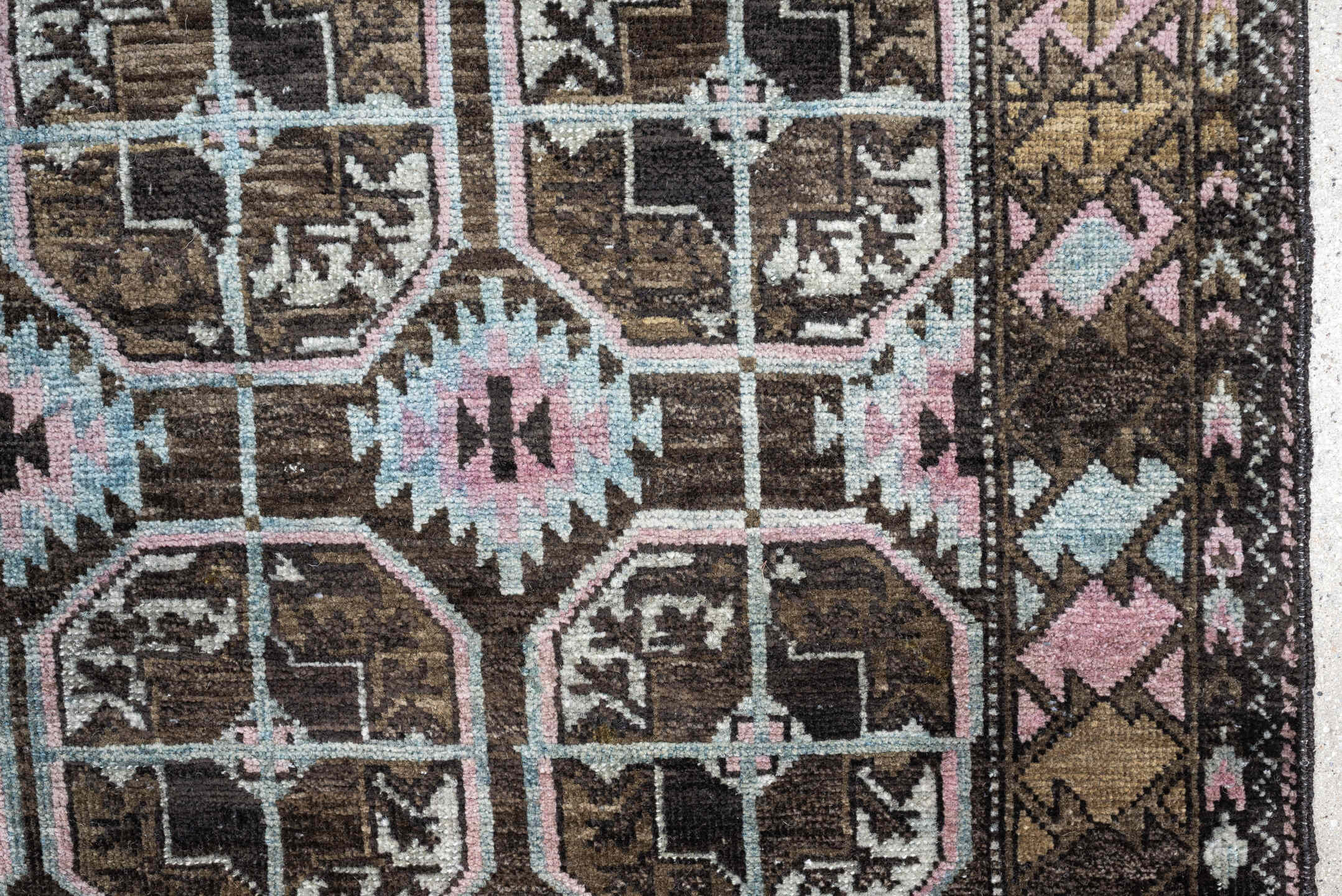 2' x 4' one-of-a-kind handmade antique Belouch small size rug. Color palette: brown, camel, blush pink, pale aqua, ivory