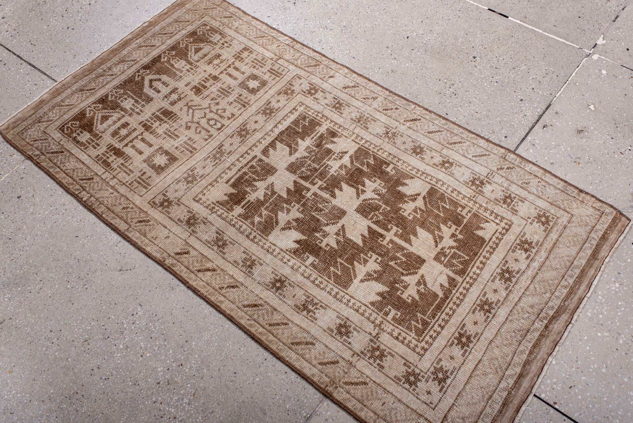 2' x 4' one-of-a-kind handmade antique Belouch small size rug. Color palette: ivory, taupe, camel, brown, beige, gray