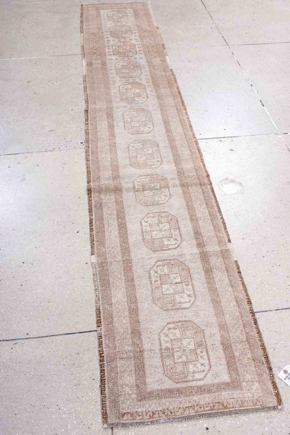 1' x 9' one-of-a-kind handmade antique Afghan rug. Color palette: ivory, taupe, beige, camel, sand, gray
