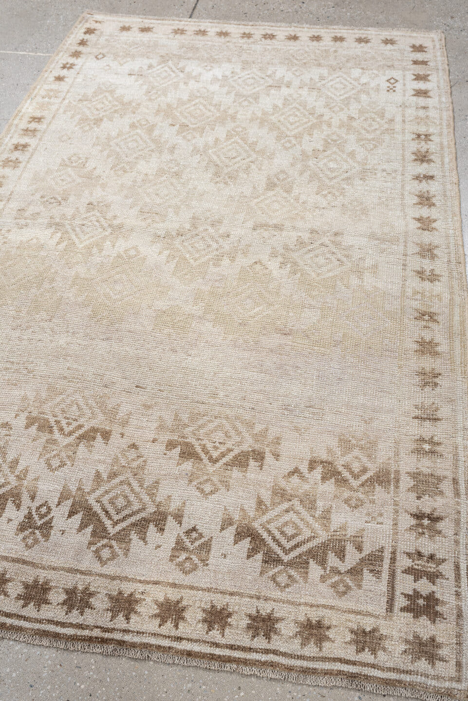 3' x 5' one-of-a-kind handmade antique Belouch small size rug. Color palette: ivory, camel, taupe, sand, beige, gray