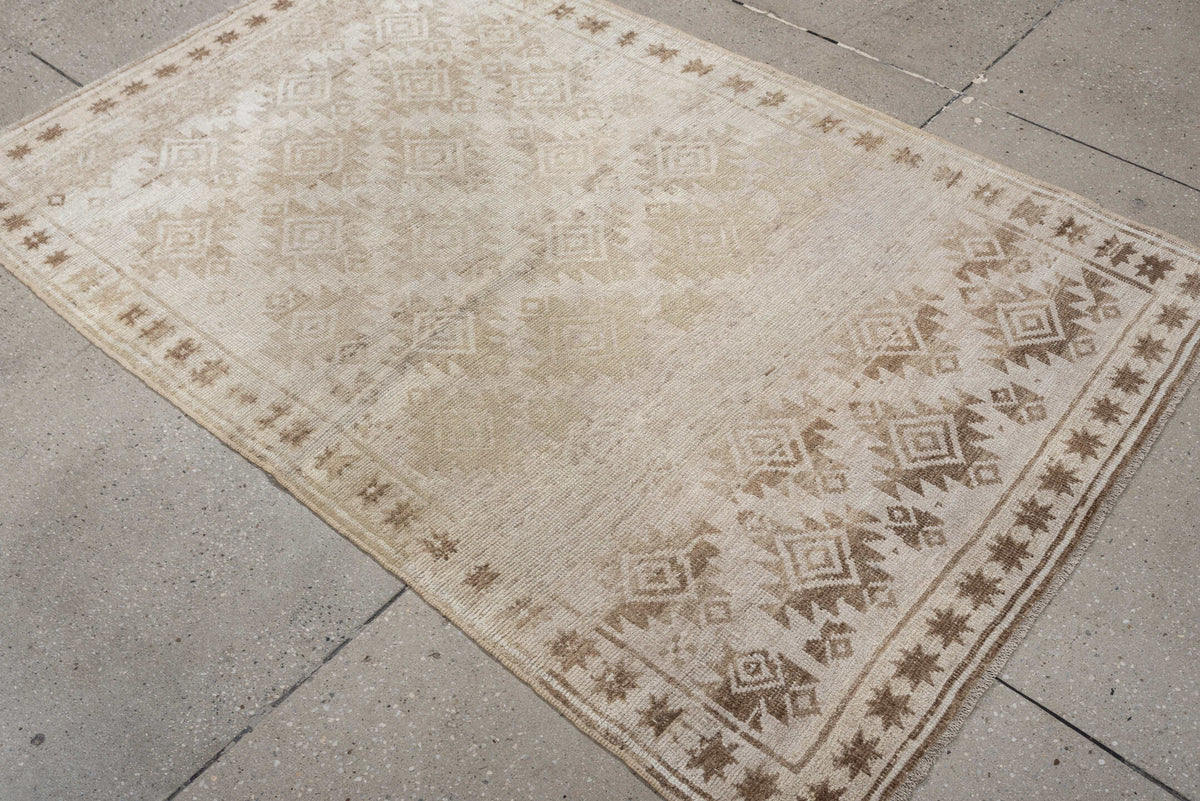 3' x 5' one-of-a-kind handmade antique Belouch small size rug. Color palette: ivory, camel, taupe, sand, beige, gray