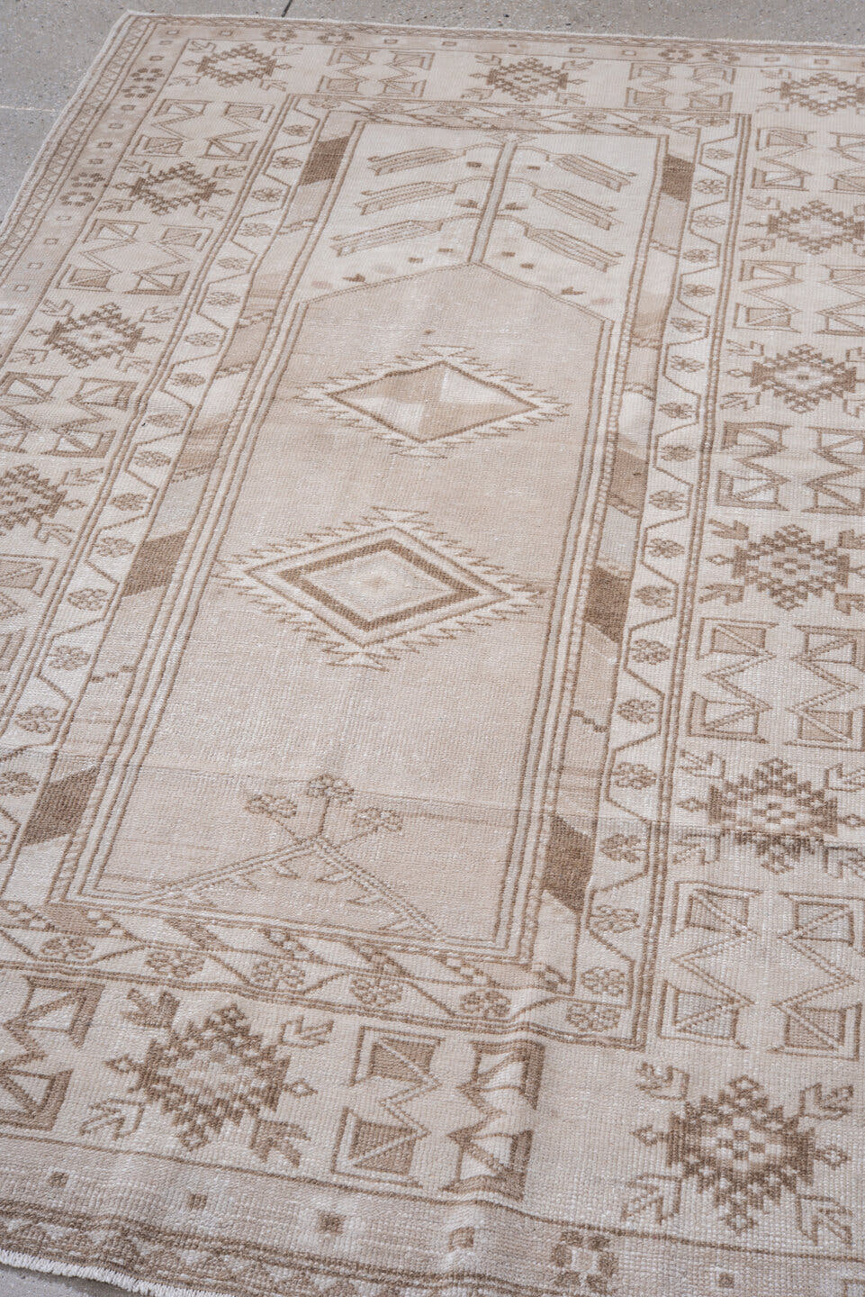 4' x 7' one-of-a-kind handmade vintage Anatolian rug. Color palette: ivory, taupe, beige, camel, light brown, gray, brown