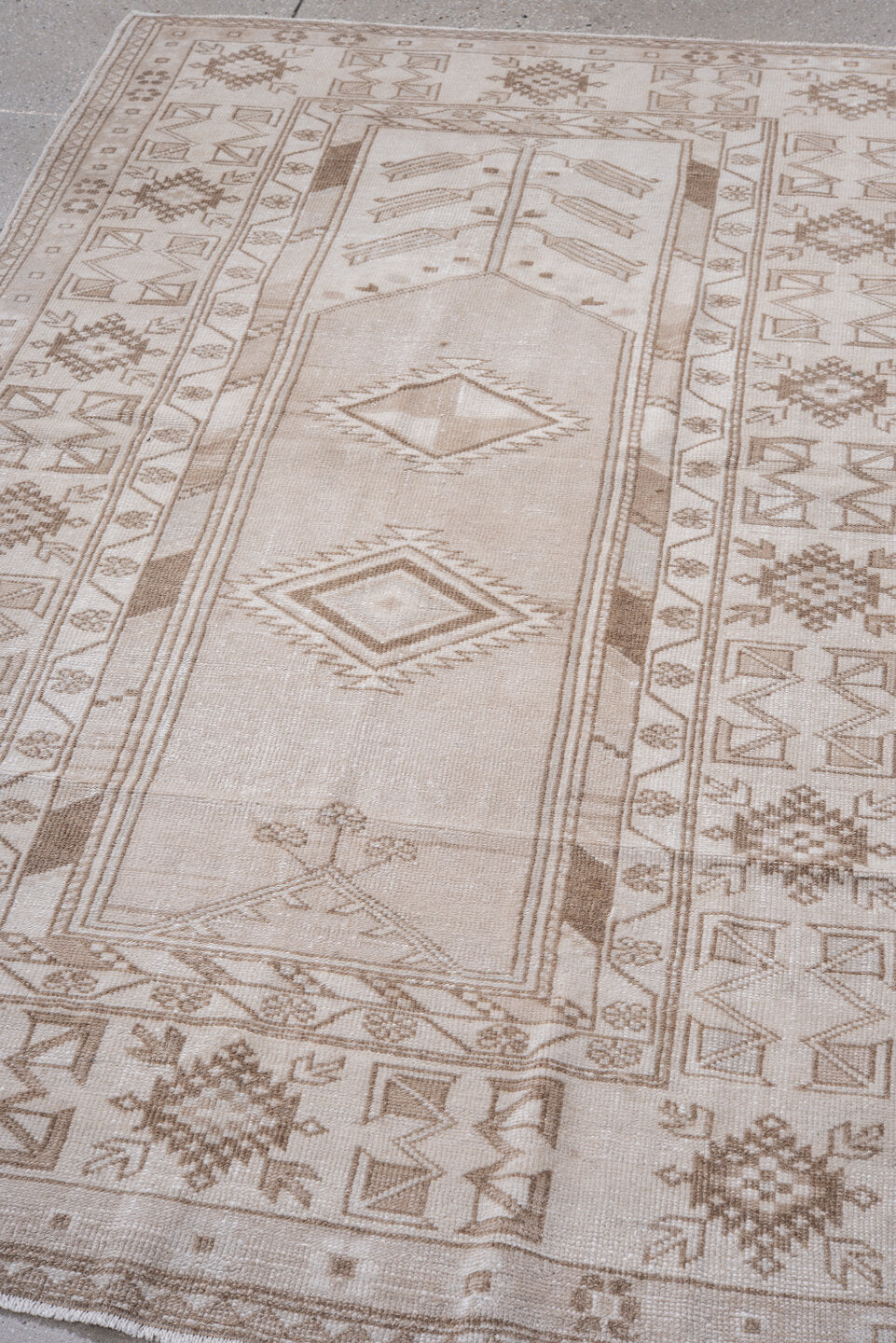 4' x 7' one-of-a-kind handmade vintage Anatolian rug. Color palette: ivory, taupe, beige, camel, light brown, gray, brown