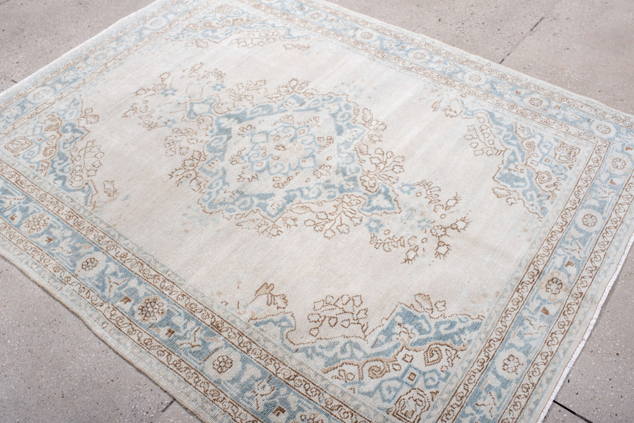 5' x 6' one-of-a-kind handmade antique Malayer rug. Color palette: ivory, pale blue, taupe, cream, camel, light blue, beige