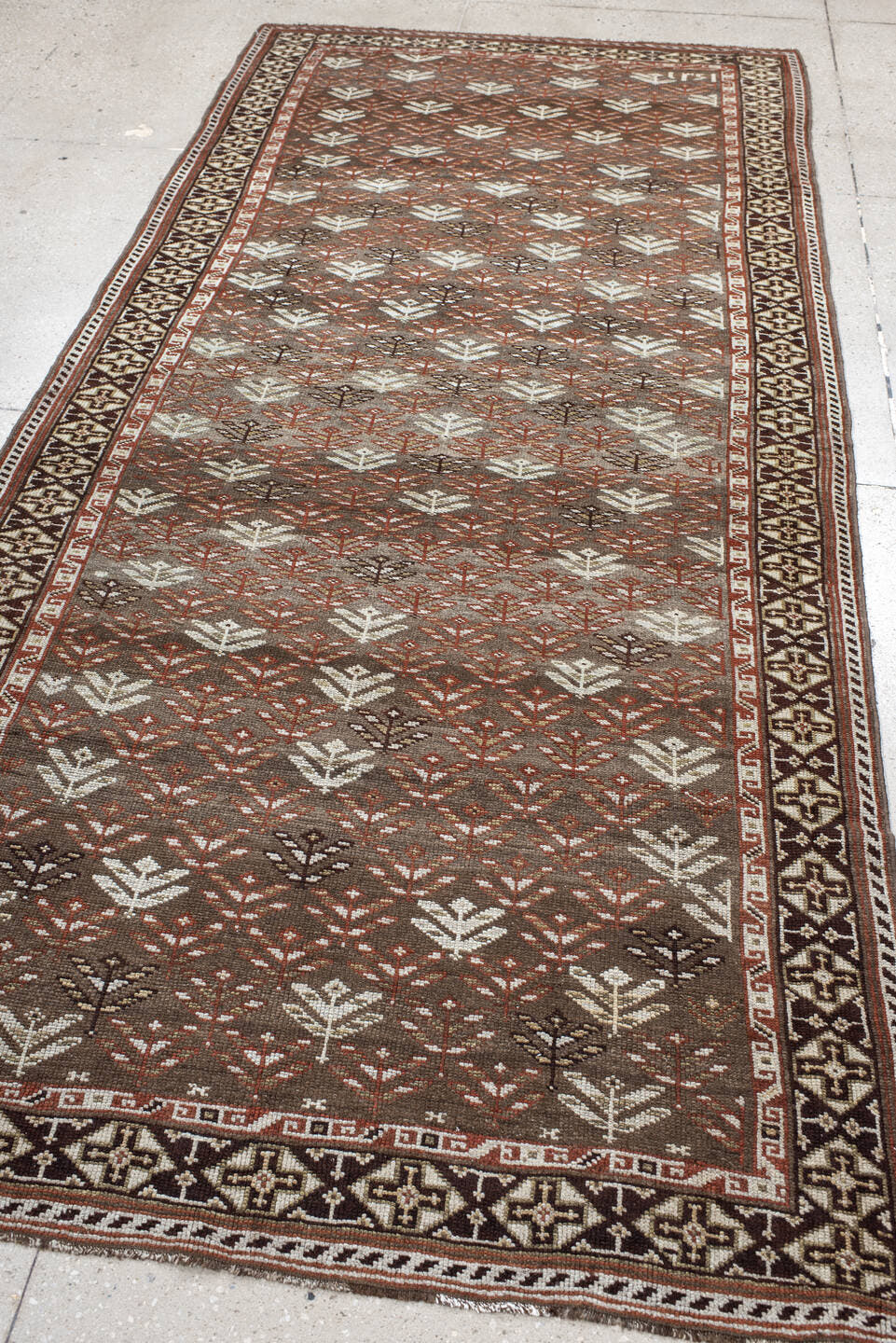 4' x 9' one-of-a-kind handmade antique Kurd runner rug. Color palette: taupe, brown, ivory, rust, charcoal, beige, gray