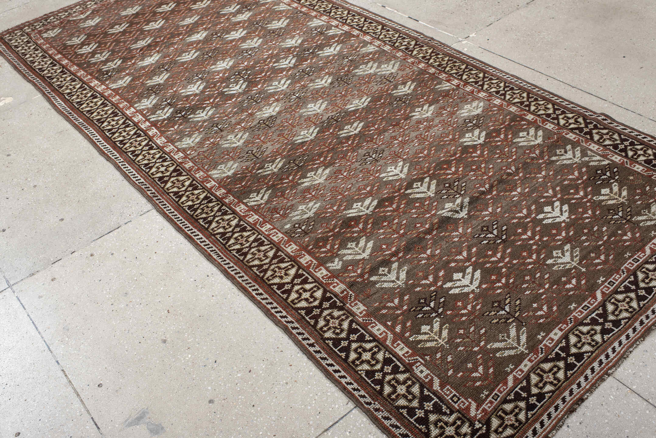 4' x 9' one-of-a-kind handmade antique Kurd runner rug. Color palette: taupe, brown, ivory, rust, charcoal, beige, gray