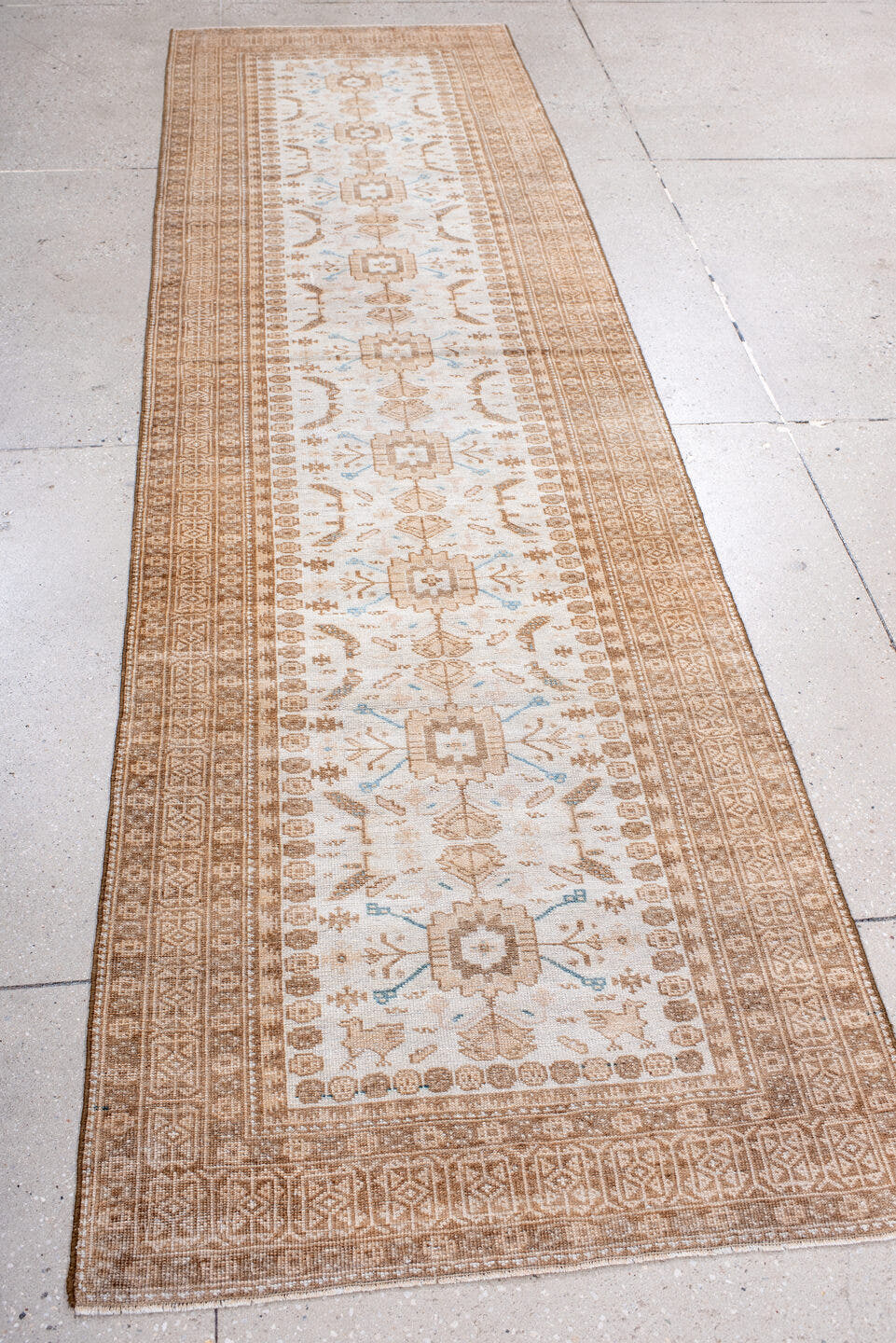 2' x 10' one-of-a-kind handmade antique Belouch runner rug. Color palette: ivory, camel, taupe, sand, pale blue, beige, gray