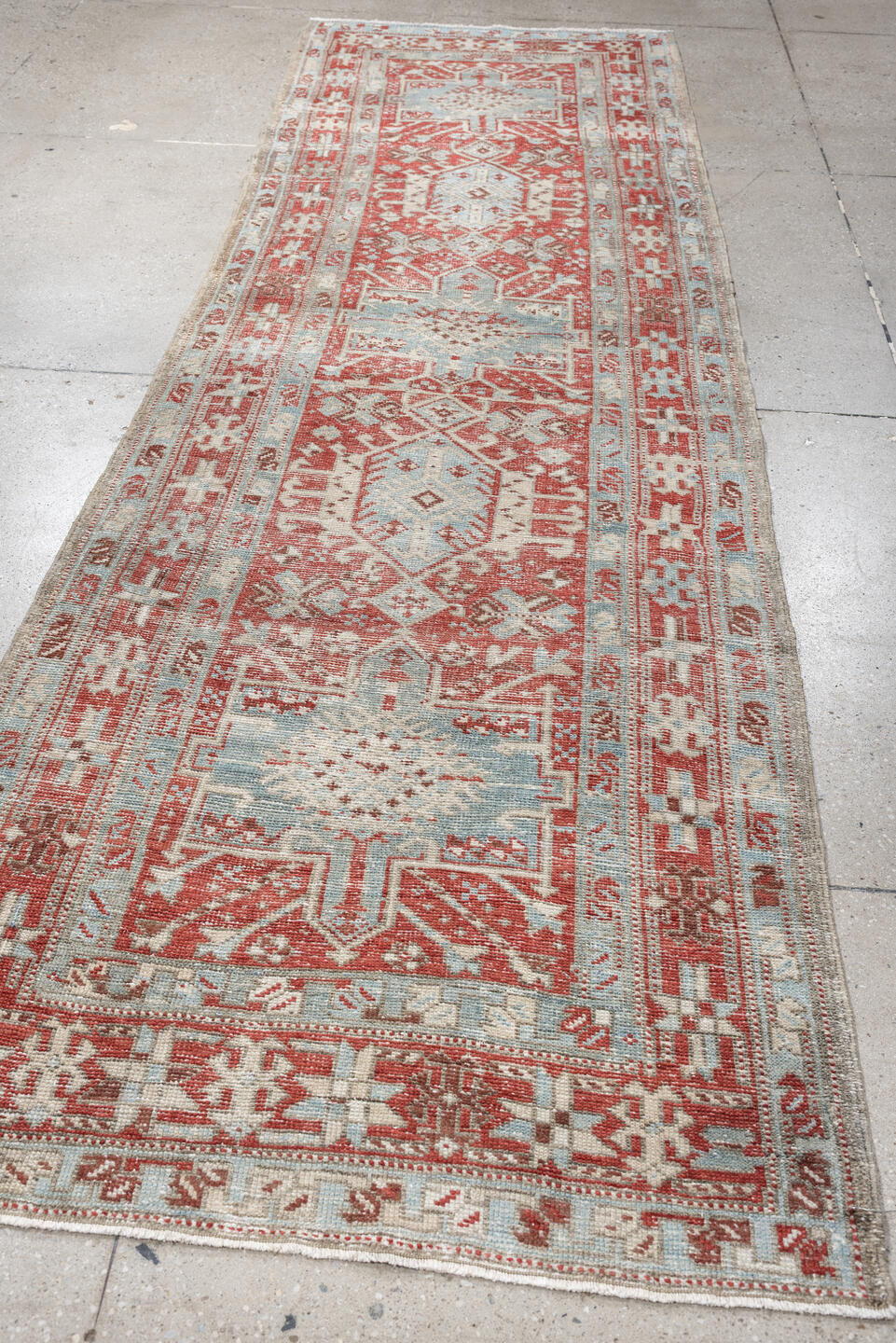 3' x 10' one-of-a-kind handmade vintage Heriz runner rug. Color palette: pale blue, terracotta, ivory, brick red, taupe