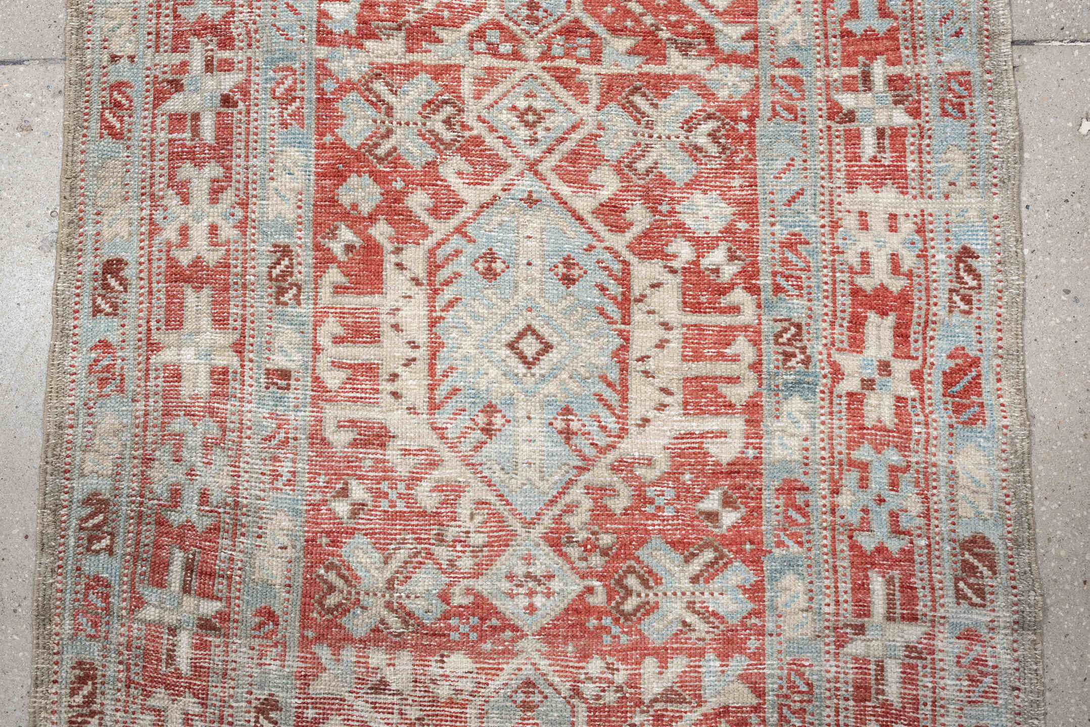 3' x 10' one-of-a-kind handmade vintage Heriz runner rug. Color palette: pale blue, terracotta, ivory, brick red, taupe