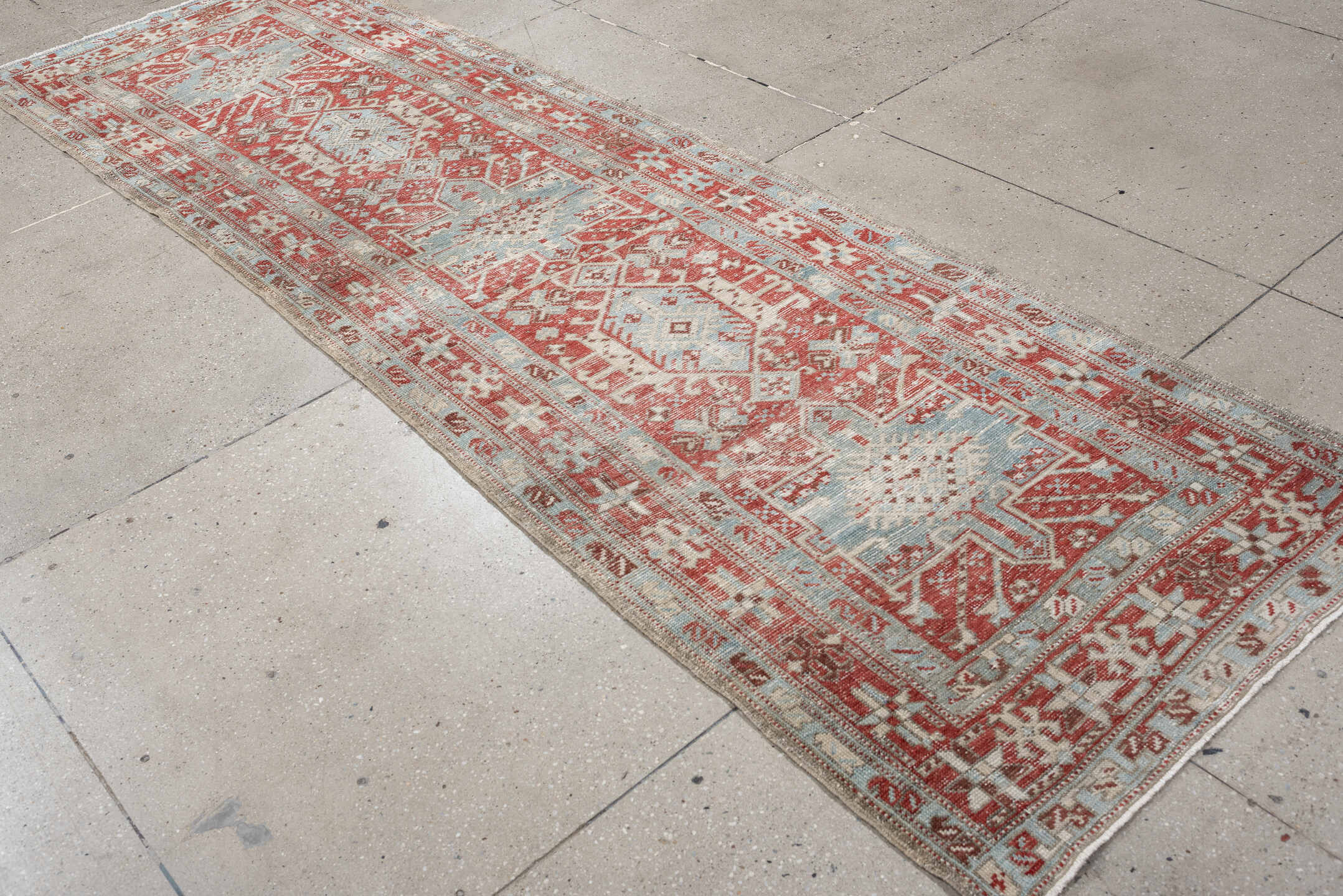 3' x 10' one-of-a-kind handmade vintage Heriz runner rug. Color palette: pale blue, terracotta, ivory, brick red, taupe