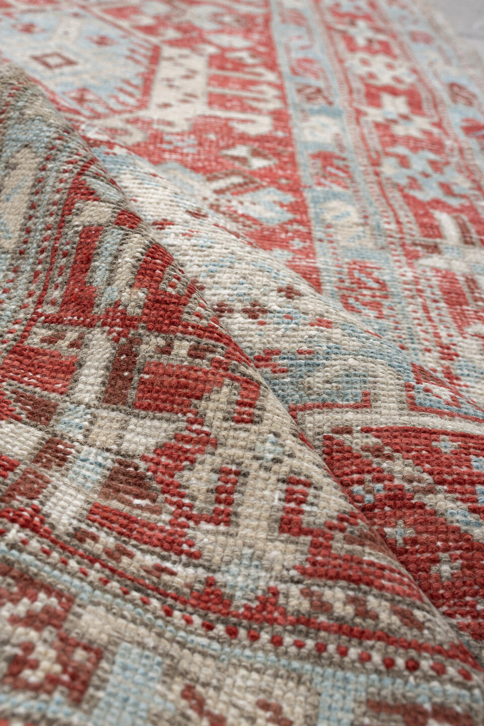 3' x 10' one-of-a-kind handmade vintage Heriz runner rug. Color palette: pale blue, terracotta, ivory, brick red, taupe