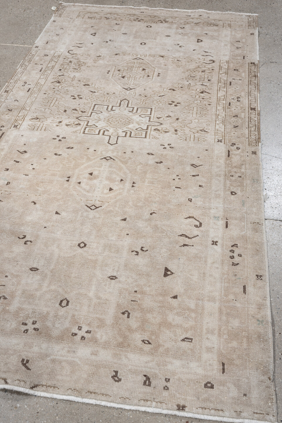 6' x 3' one-of-a-kind handmade vintage Karaje rug. Color palette: ivory, taupe, beige, camel, brown, gray