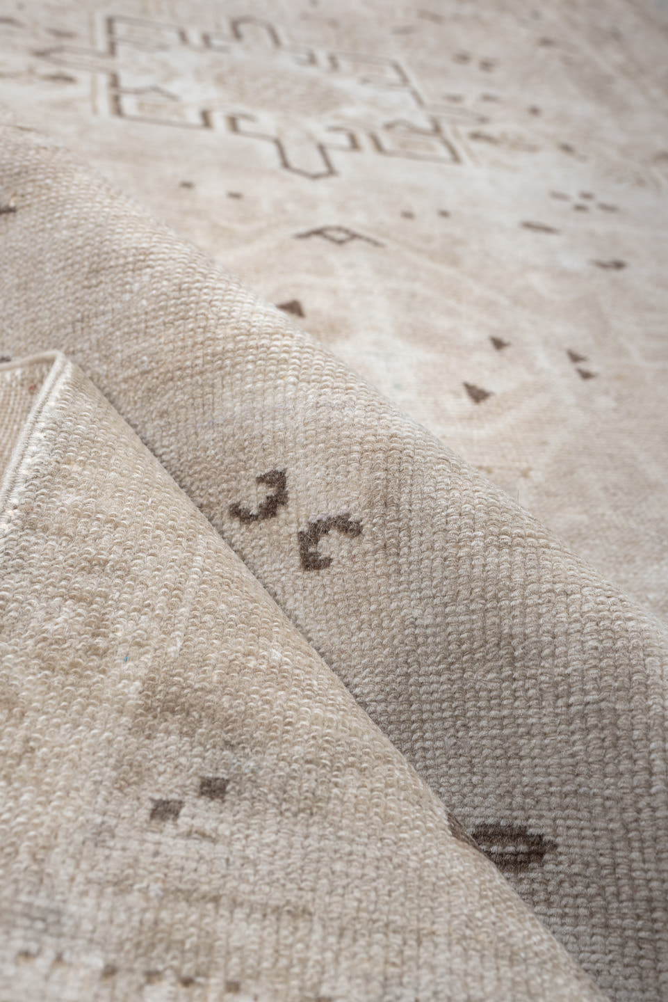 6' x 3' one-of-a-kind handmade vintage Karaje rug. Color palette: ivory, taupe, beige, camel, brown, gray