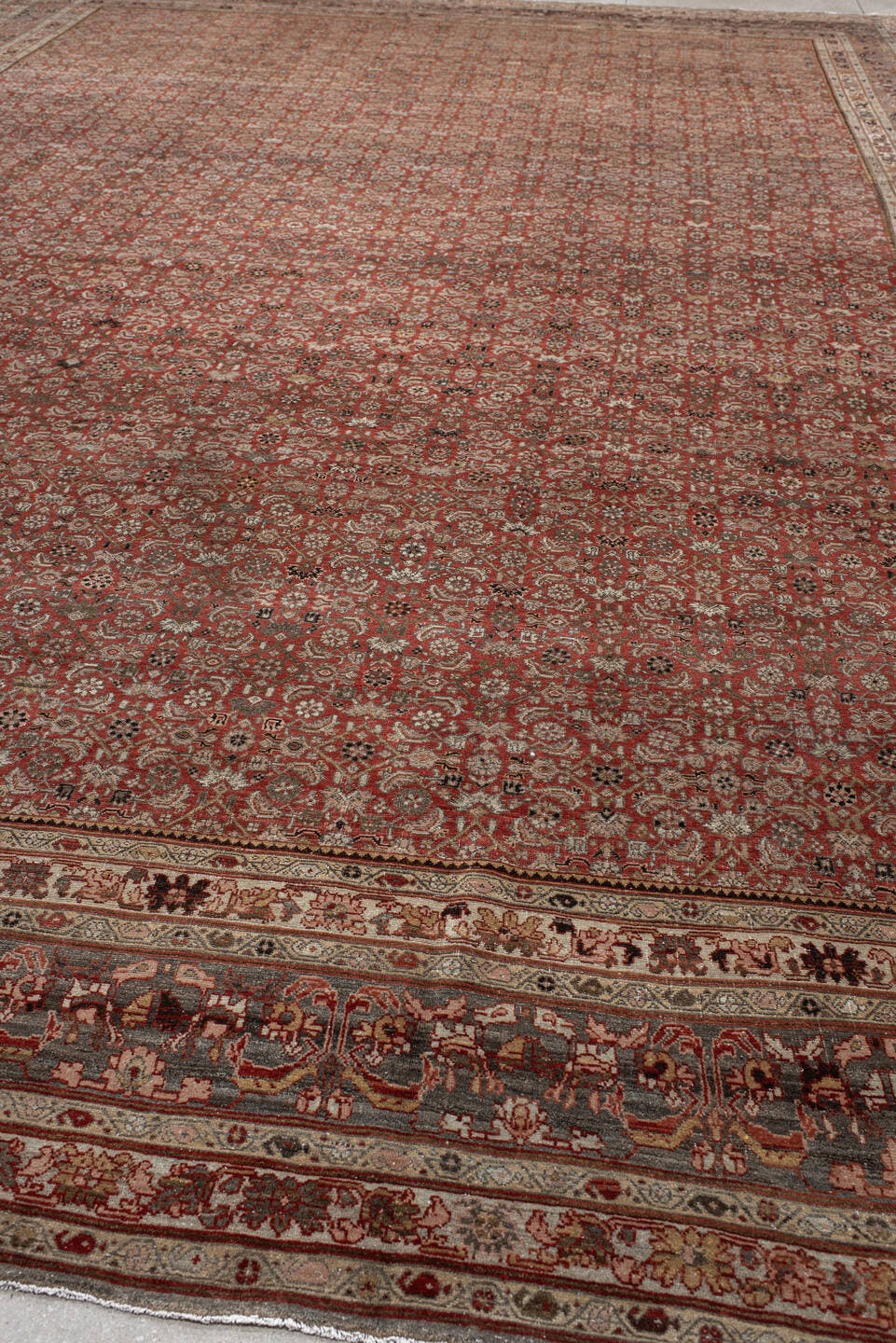 11' x 17' one-of-a-kind handmade antique Bidjar oversize rug. Color palette: rust, ivory, charcoal, slate, rose, taupe