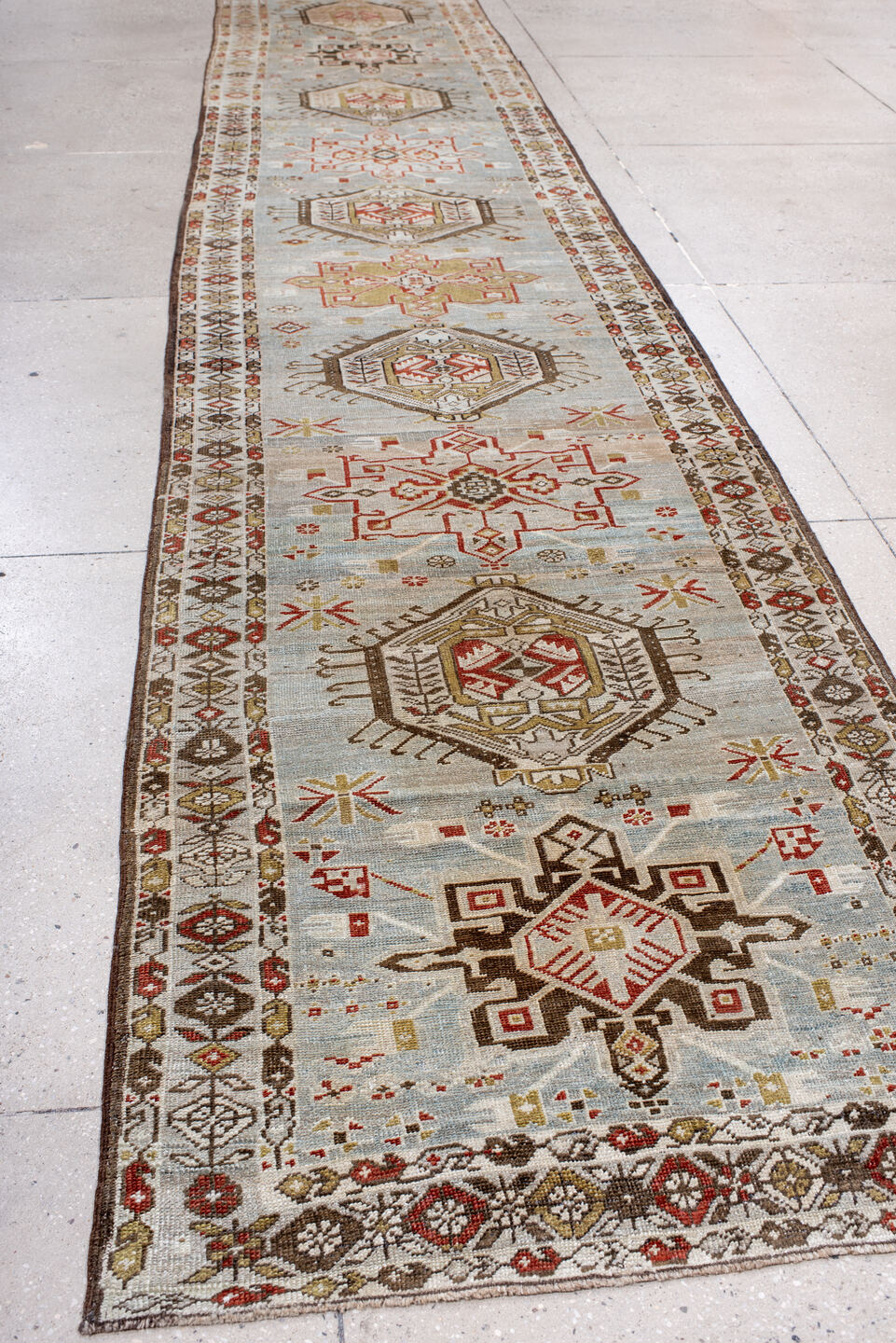 3' x 17' one-of-a-kind handmade antique Heriz runner rug. Color palette: light blue, ivory, rust, brown, camel, gold, taupe