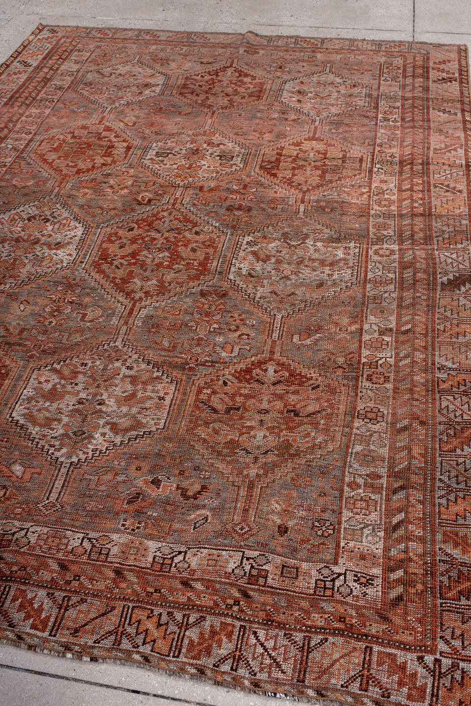 6' x 9' one-of-a-kind handmade antique Shiraz medium size rug. Color palette: rose, rust, terra cotta, ivory, taupe, brown