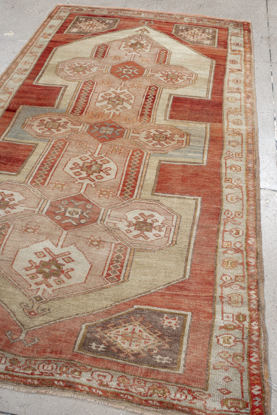 4' x 7' one-of-a-kind handmade vintage Anatolian rug. Color palette: ivory, terra cotta, rust, taupe, sage, camel, rose