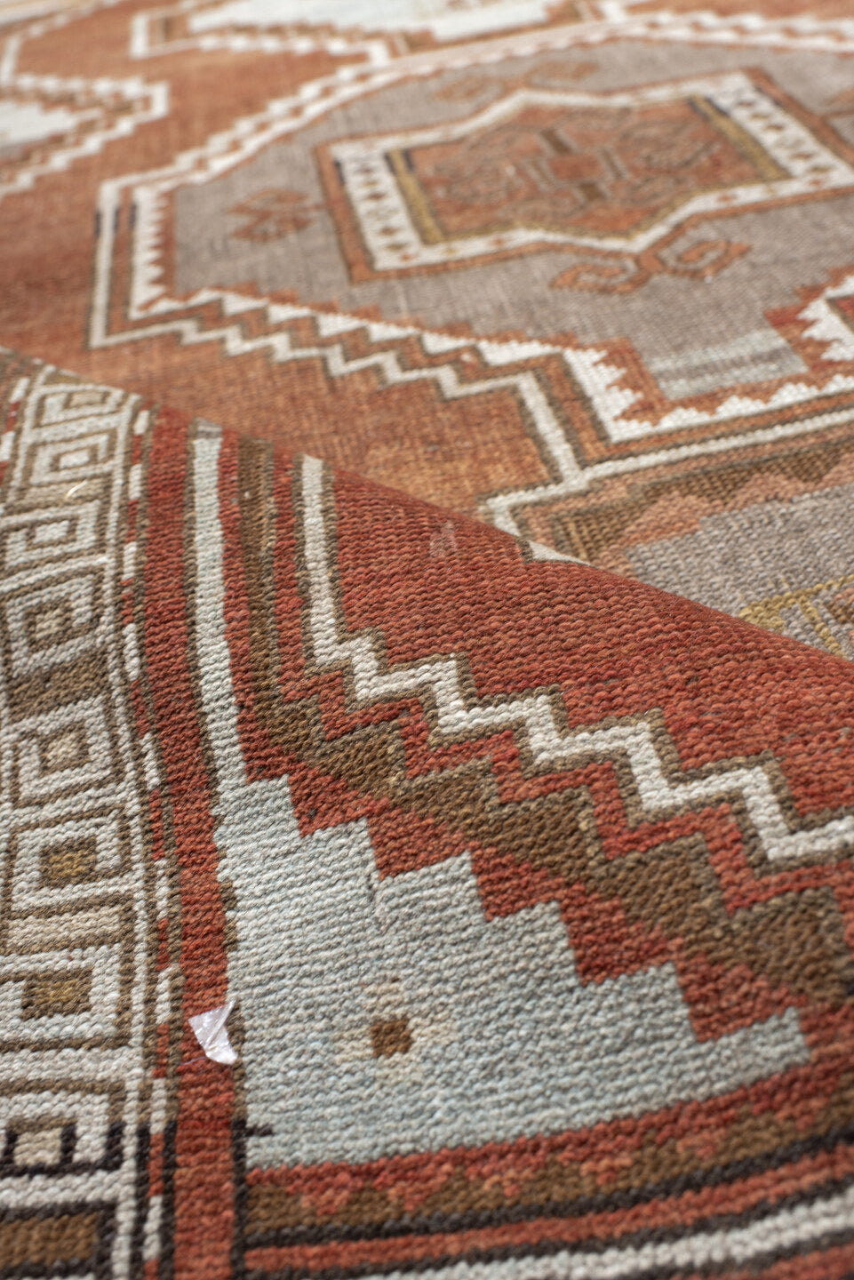 4' x 5' one-of-a-kind handmade vintage Caucasian small size rug. Color palette: brown, floral white, gray, light gray, linen