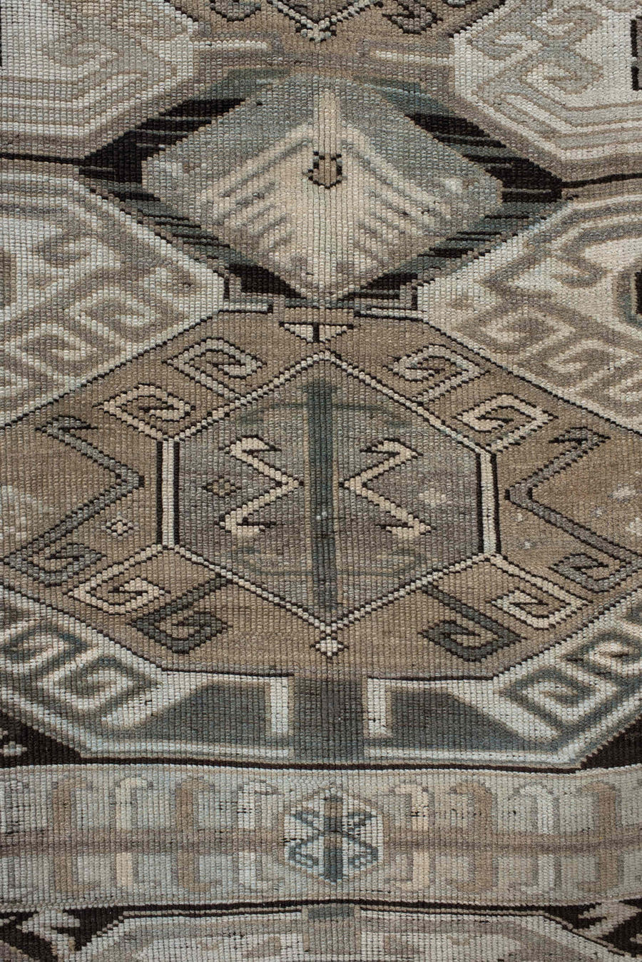 4' x 10' one-of-a-kind handmade antique Caucasian runner rug. Color palette: ivory, charcoal, taupe, brown, slate, gray
