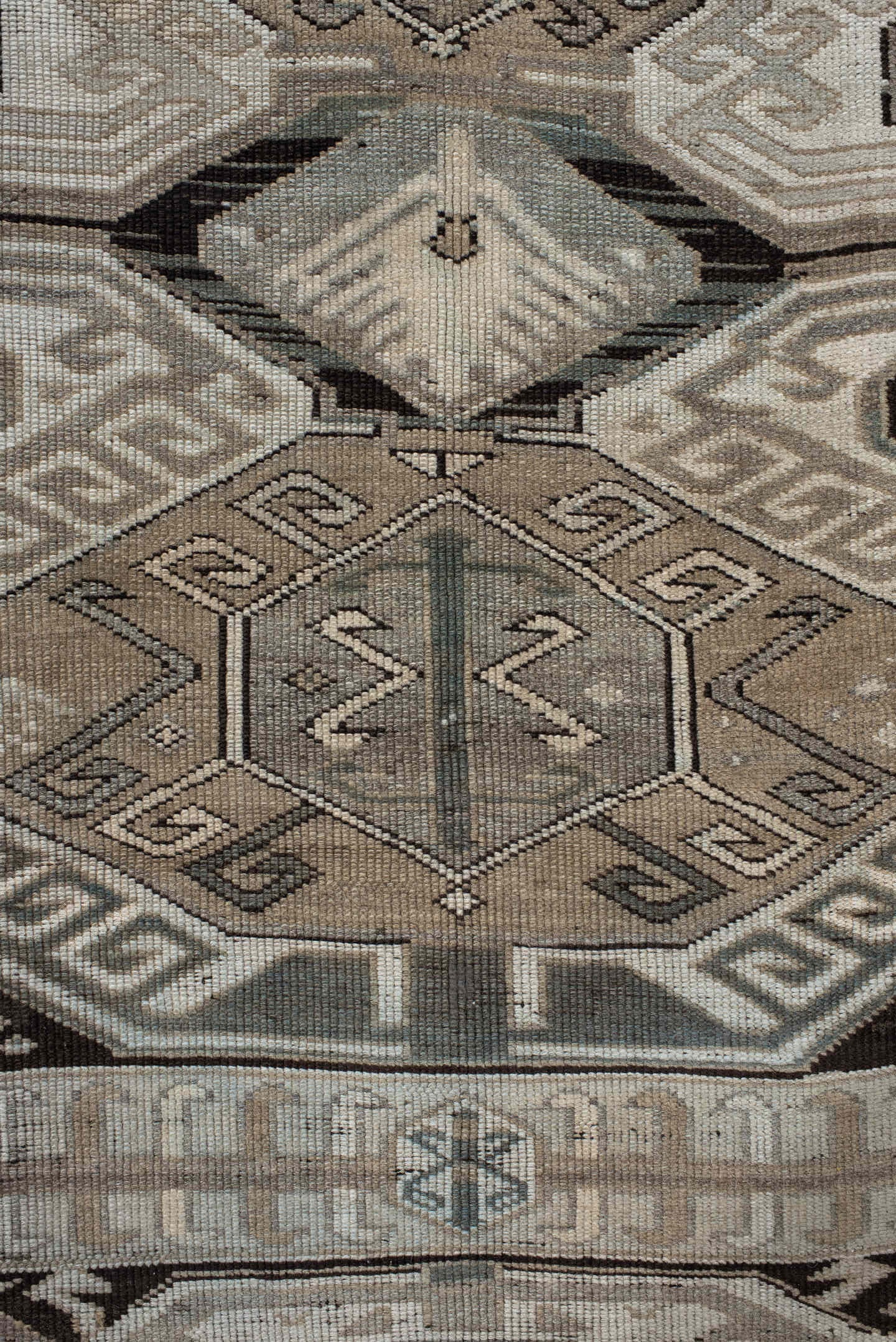 4' x 10' one-of-a-kind handmade antique Caucasian runner rug. Color palette: ivory, charcoal, taupe, brown, slate, gray