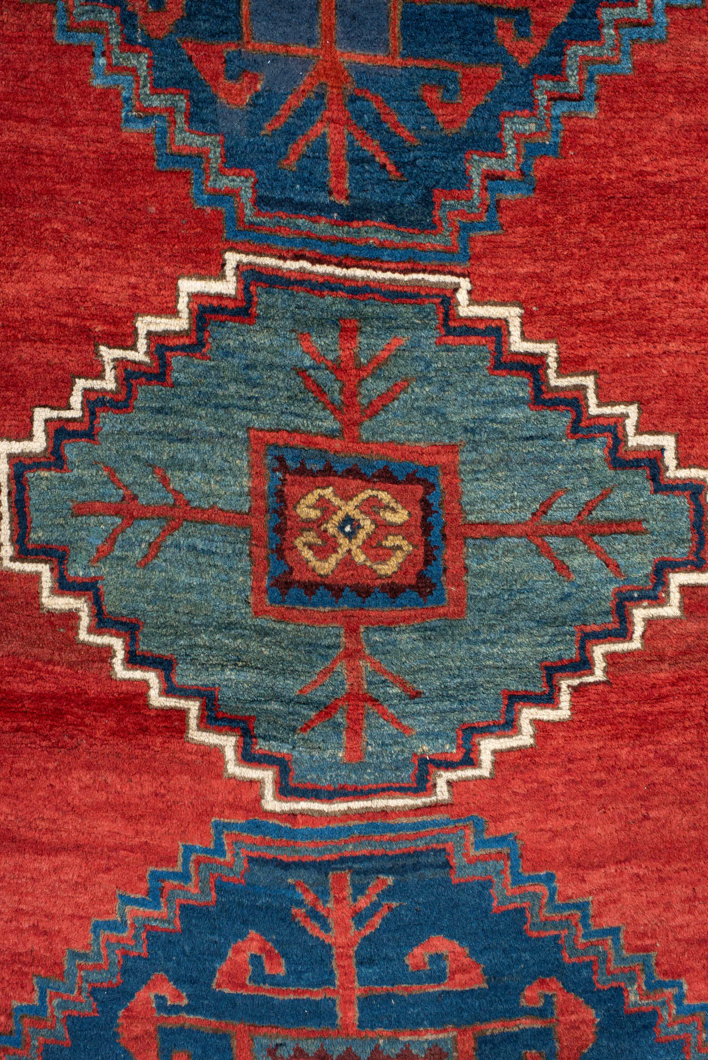 4' x 6' one-of-a-kind handmade antique Kazak small size rug. Color palette: rust, navy, sky_blue, ivory, brick, teal
