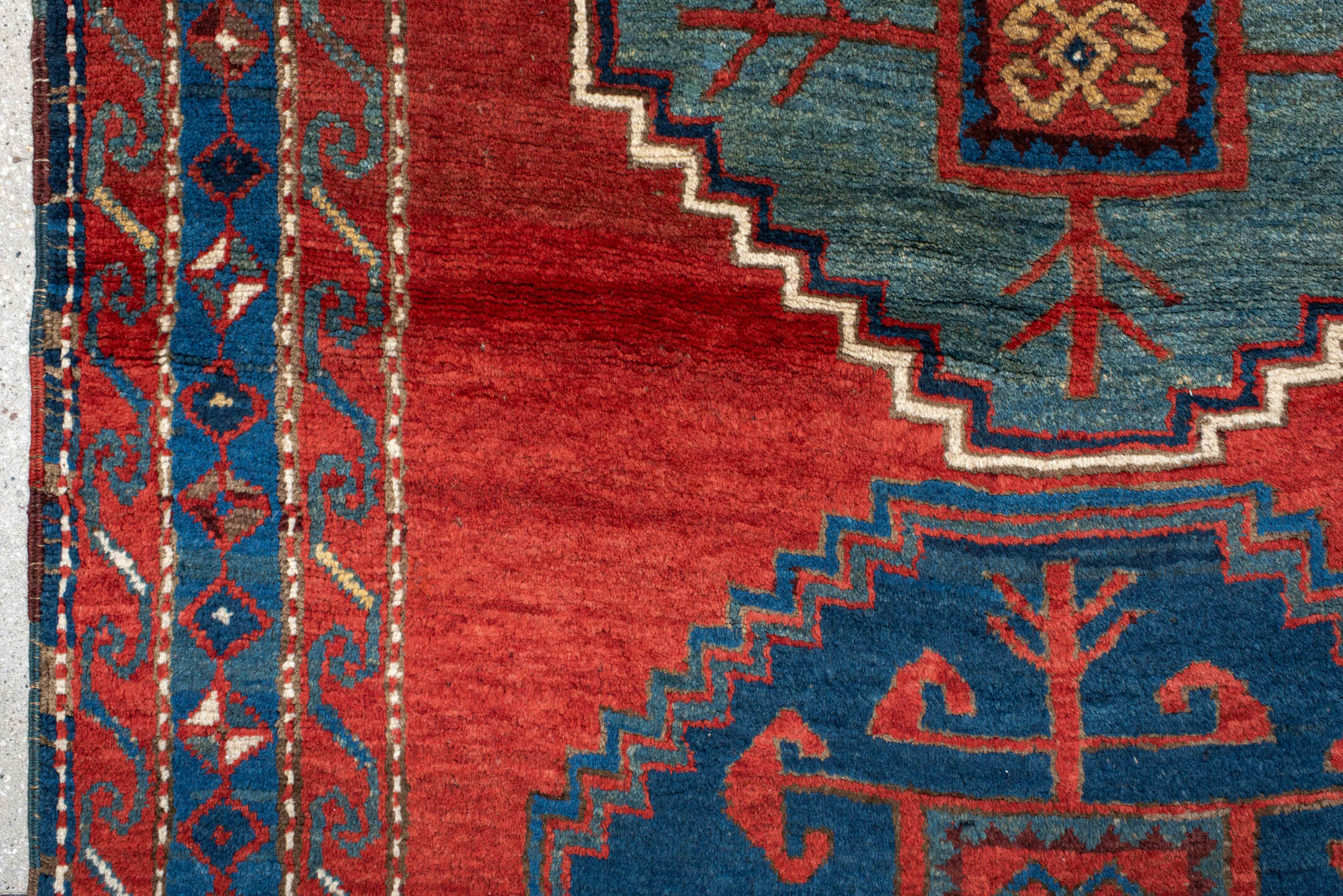 4' x 6' one-of-a-kind handmade antique Kazak small size rug. Color palette: rust, navy, sky_blue, ivory, brick, teal