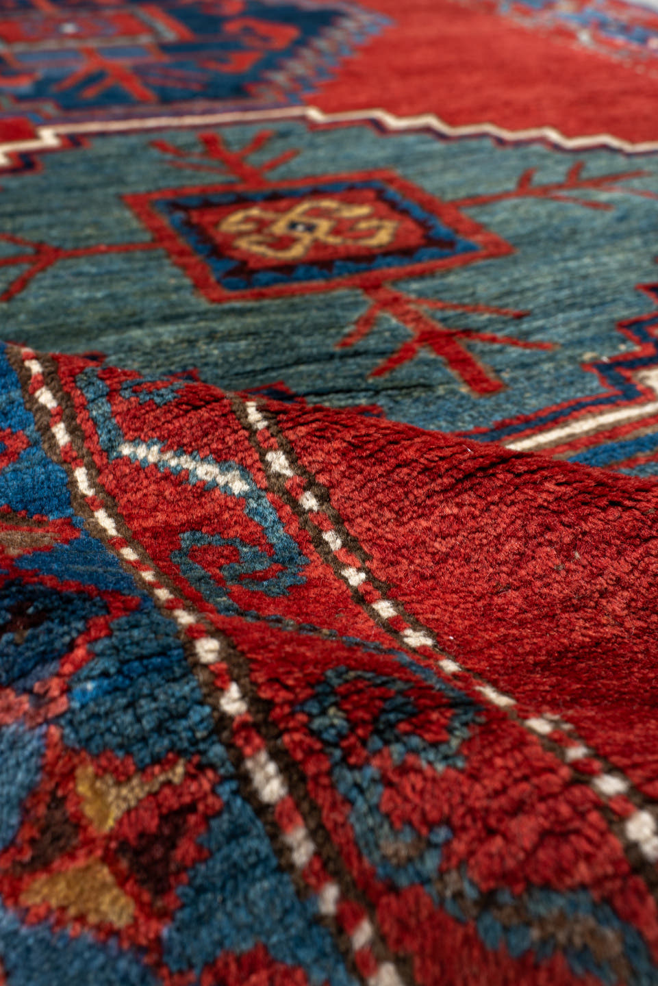 4' x 6' one-of-a-kind handmade antique Kazak small size rug. Color palette: rust, navy, sky_blue, ivory, brick, teal