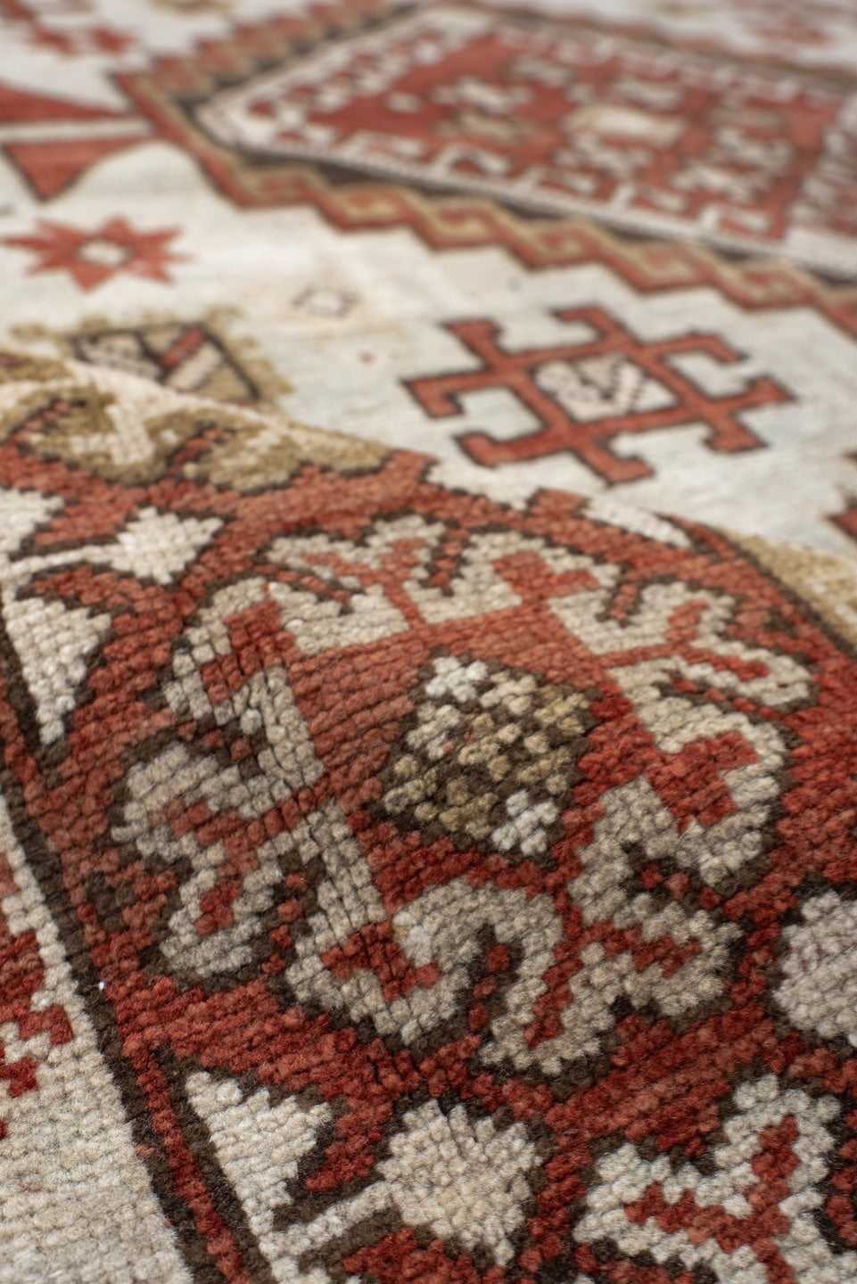4' x 8' one-of-a-kind handmade vintage Caucasian medium size rug. Color palette: ivory, rust, taupe, brown, charcoal, beige