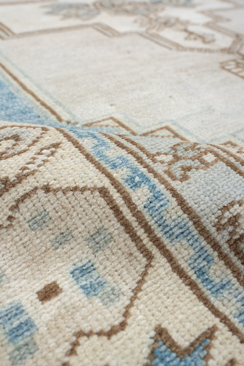 4' x 7' one-of-a-kind handmade vintage Anatolian rug. Color palette: ivory, sky blue, beige, taupe, camel, light blue, gray