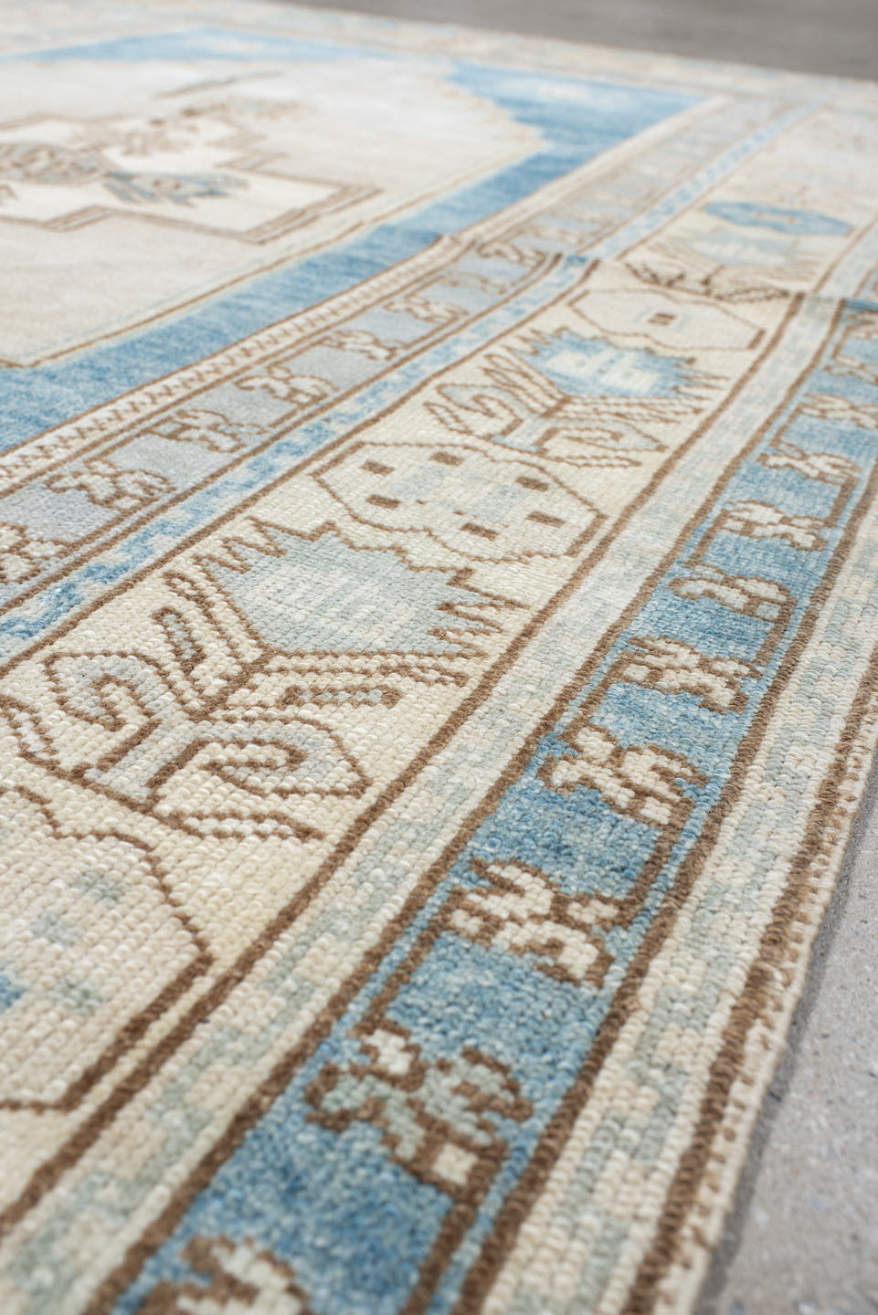 4' x 7' one-of-a-kind handmade vintage Anatolian rug. Color palette: ivory, sky blue, beige, taupe, camel, light blue, gray