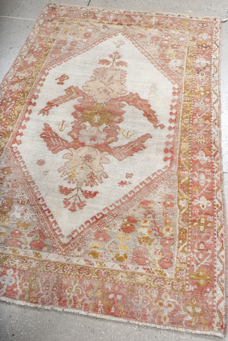 3' x 5' one-of-a-kind handmade antique Oushak small size rug. Color palette: ivory, coral, terracotta, gold, camel, rose