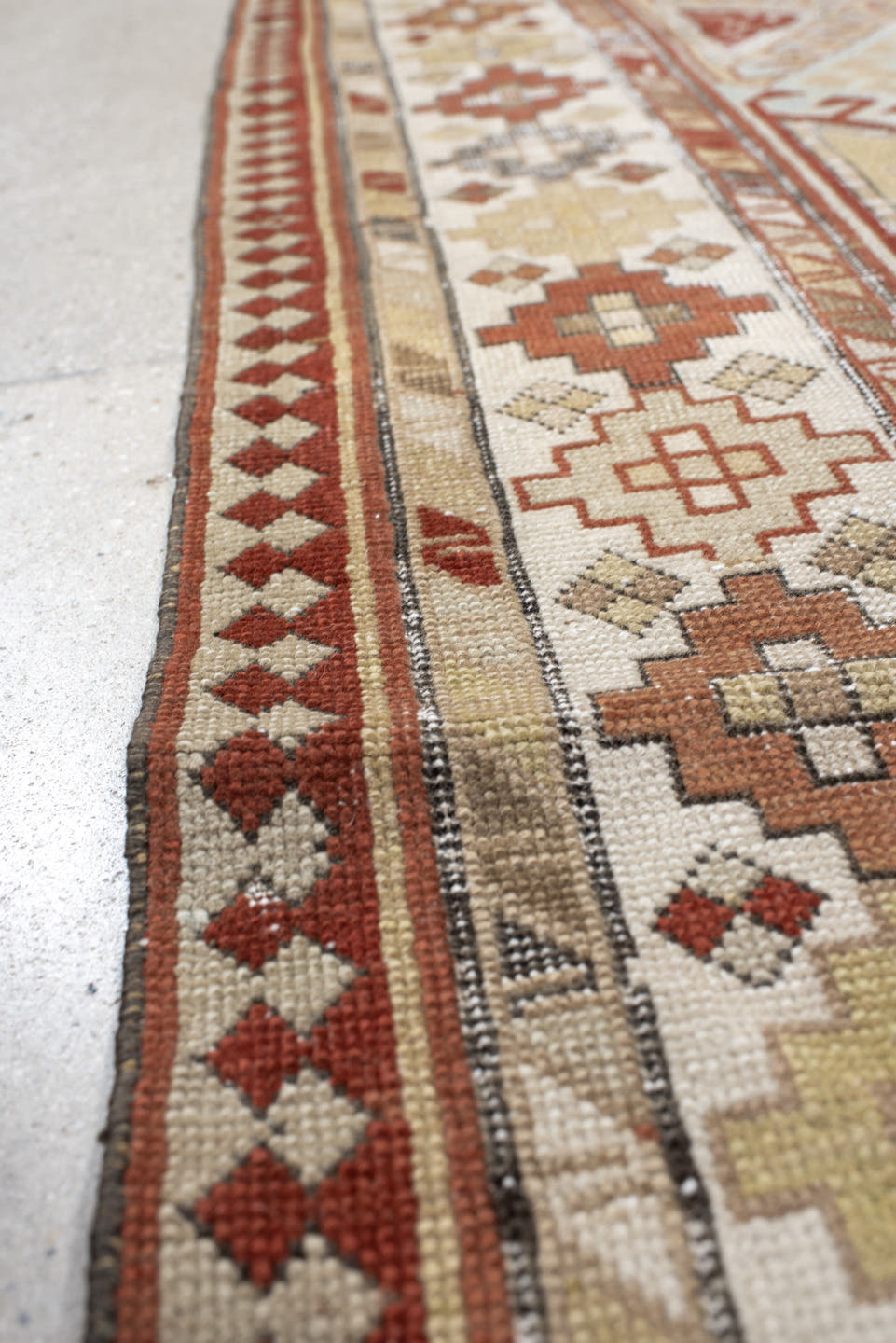 3' x 8' one-of-a-kind handmade antique Caucasian runner rug. Color palette: ivory, sky blue, rust, burgundy, camel, taupe