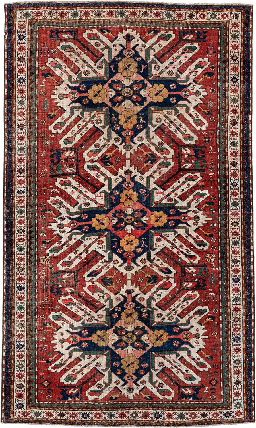 5' x 8' one-of-a-kind handmade antique Kazak medium size rug. Color palette: rust, ivory, navy, sage, gold, crimson, rose