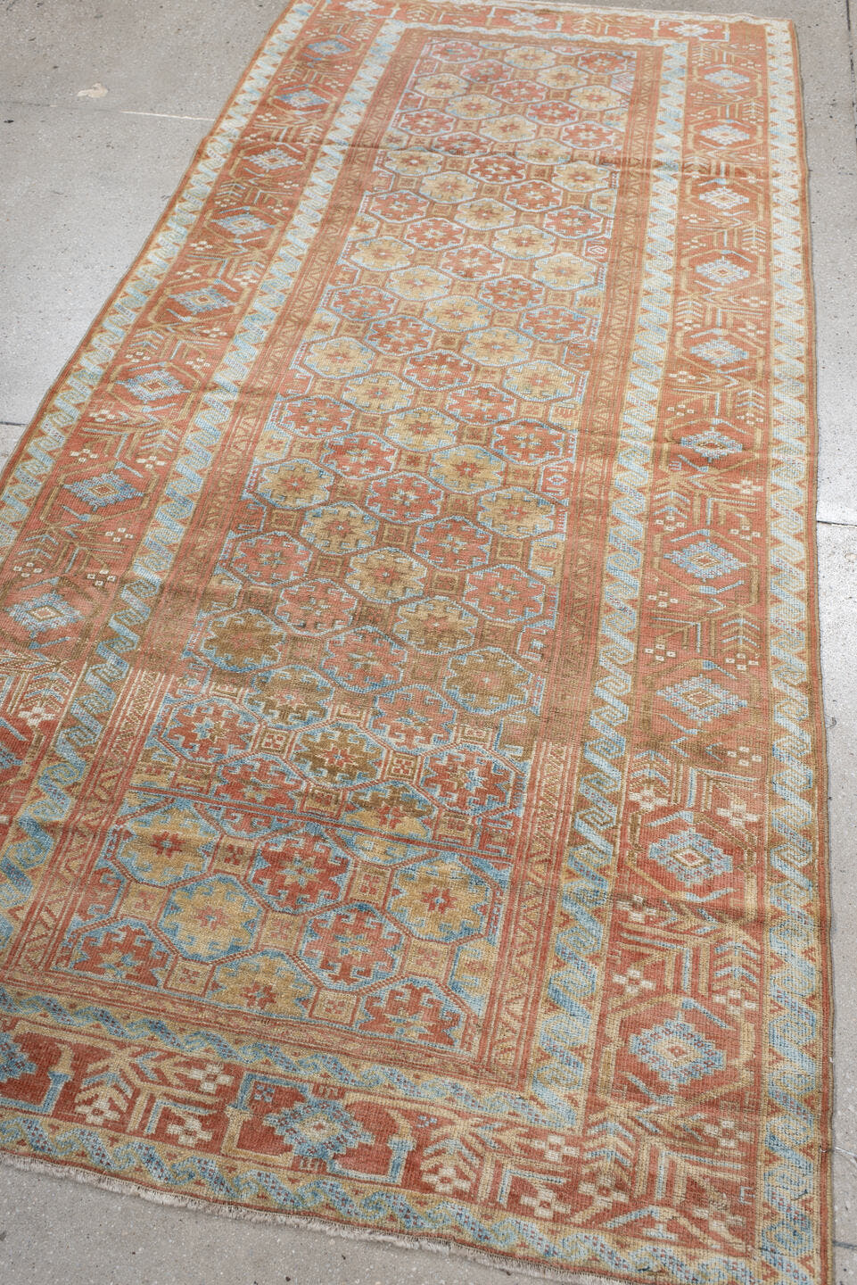 3' x 8' one-of-a-kind handmade antique Belouch runner rug. Color palette: terra cotta, ivory, pale blue, camel, taupe, rust