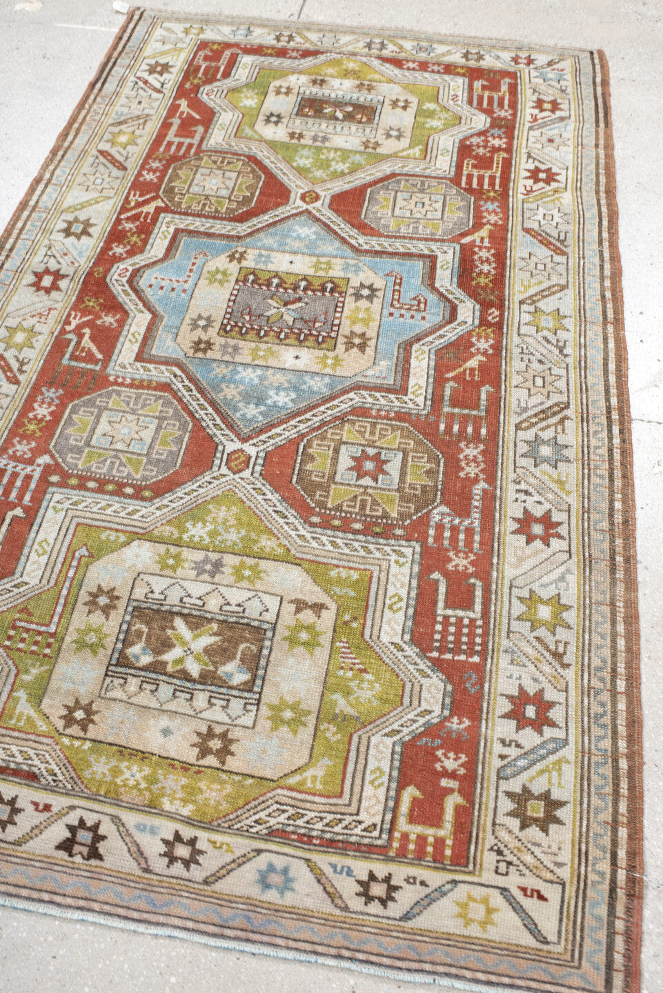 3' x 6' one-of-a-kind handmade vintage Caucasian small size rug. Color palette: rust, ivory, sage, sky blue, taupe, brown
