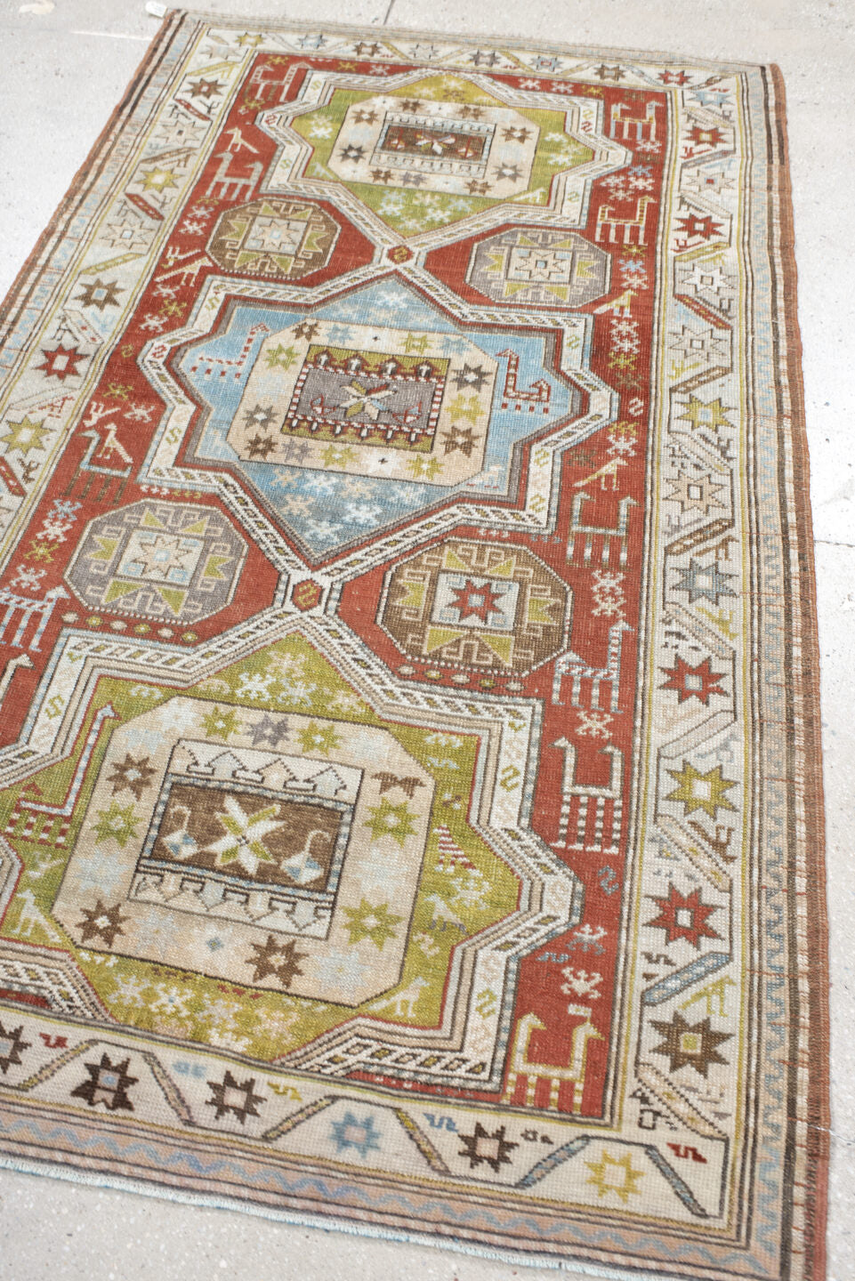 3' x 6' one-of-a-kind handmade vintage Caucasian small size rug. Color palette: rust, ivory, sage, sky blue, taupe, brown