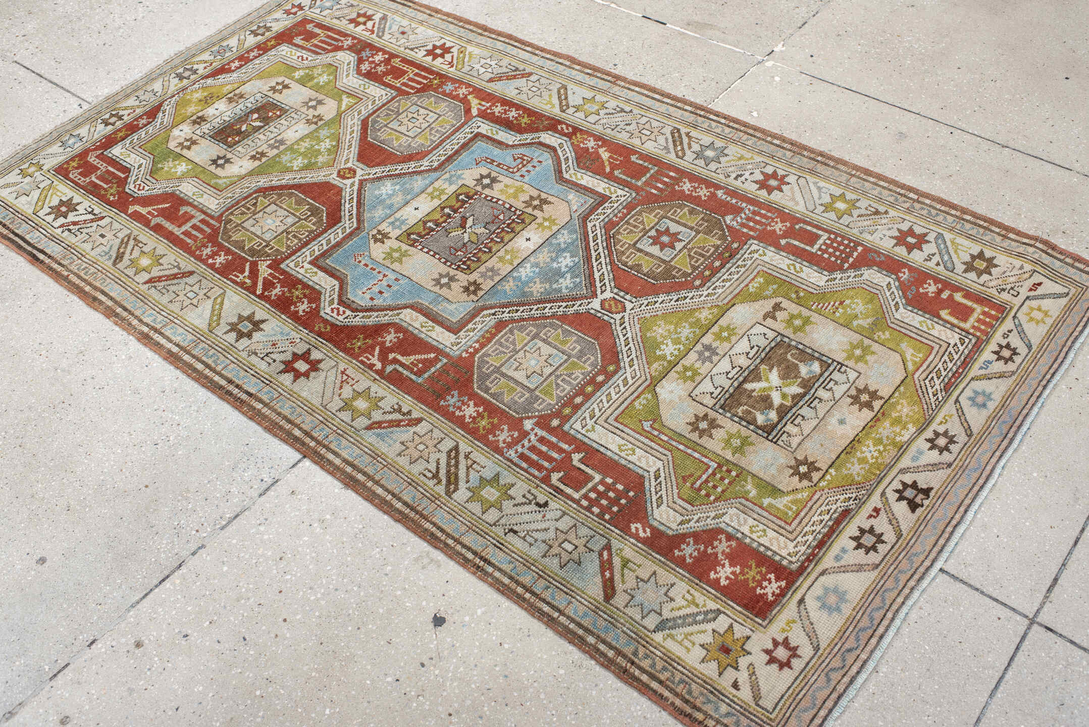 3' x 6' one-of-a-kind handmade vintage Caucasian small size rug. Color palette: rust, ivory, sage, sky blue, taupe, brown