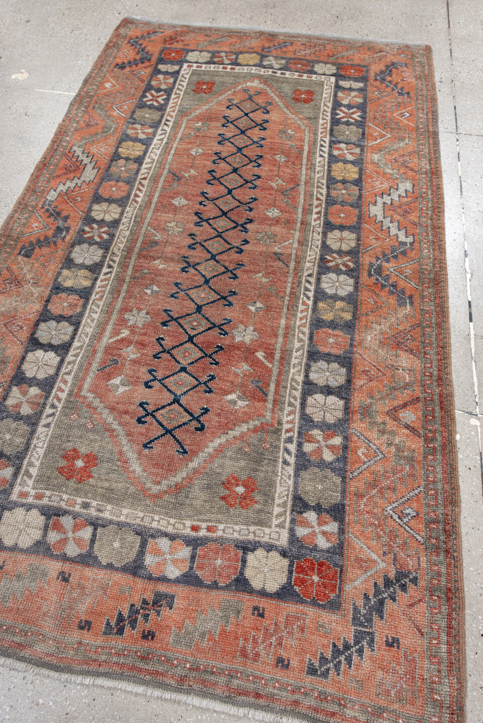 4' x 6' one-of-a-kind handmade antique Anatolian rug. Color palette: coral, gray, navy, ivory, rust, taupe, terracotta, blue