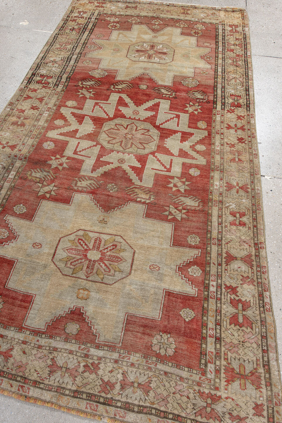 4' x 8' one-of-a-kind handmade antique Anatolian rug. Color palette: rust, ivory, cream, rose, terra cotta, beige, sage