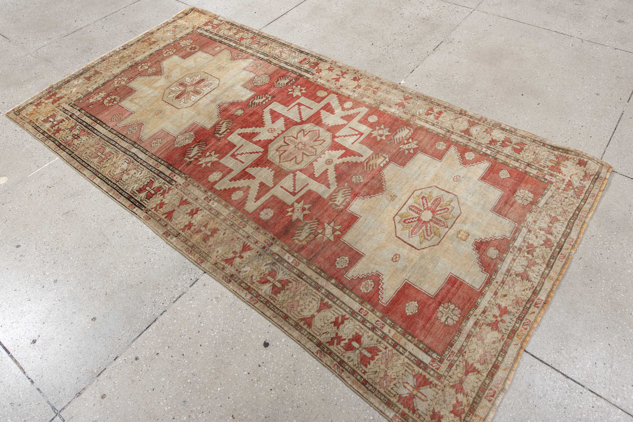 4' x 8' one-of-a-kind handmade vintage Anatol rug. Color palette: brown, gray, light gray, off-white, orange, pink, red
