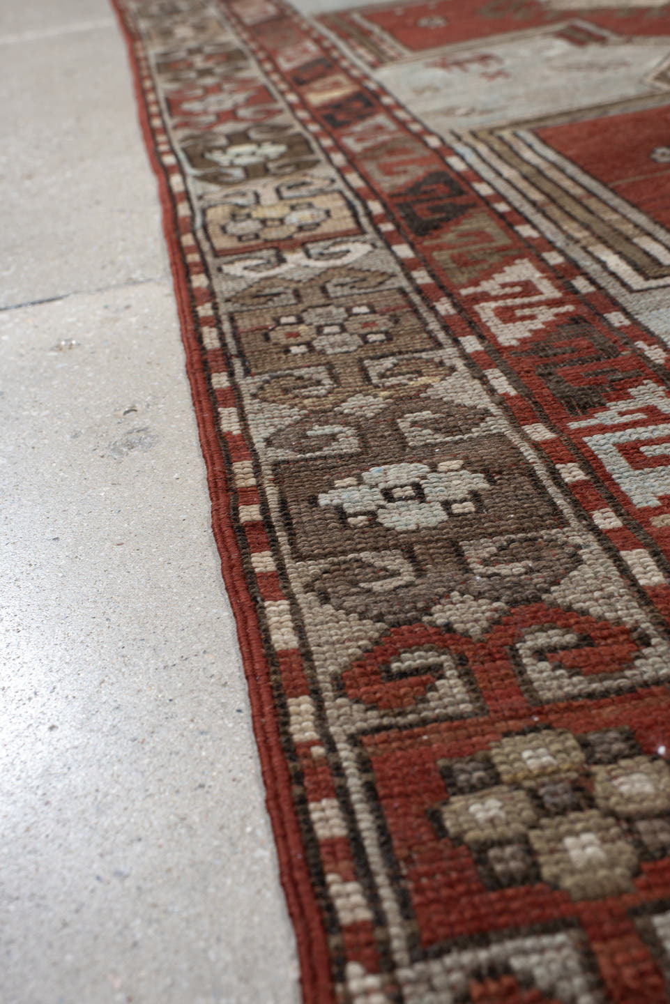 3' x 8' one-of-a-kind handmade vintage Caucasian runner rug. Color palette: ivory, rust, taupe, brown, crimson, charcoal