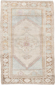 2' x 4' one-of-a-kind handmade antique Anatolian small size rug. Color palette: ivory, camel, pale blue, blush, taupe, beige