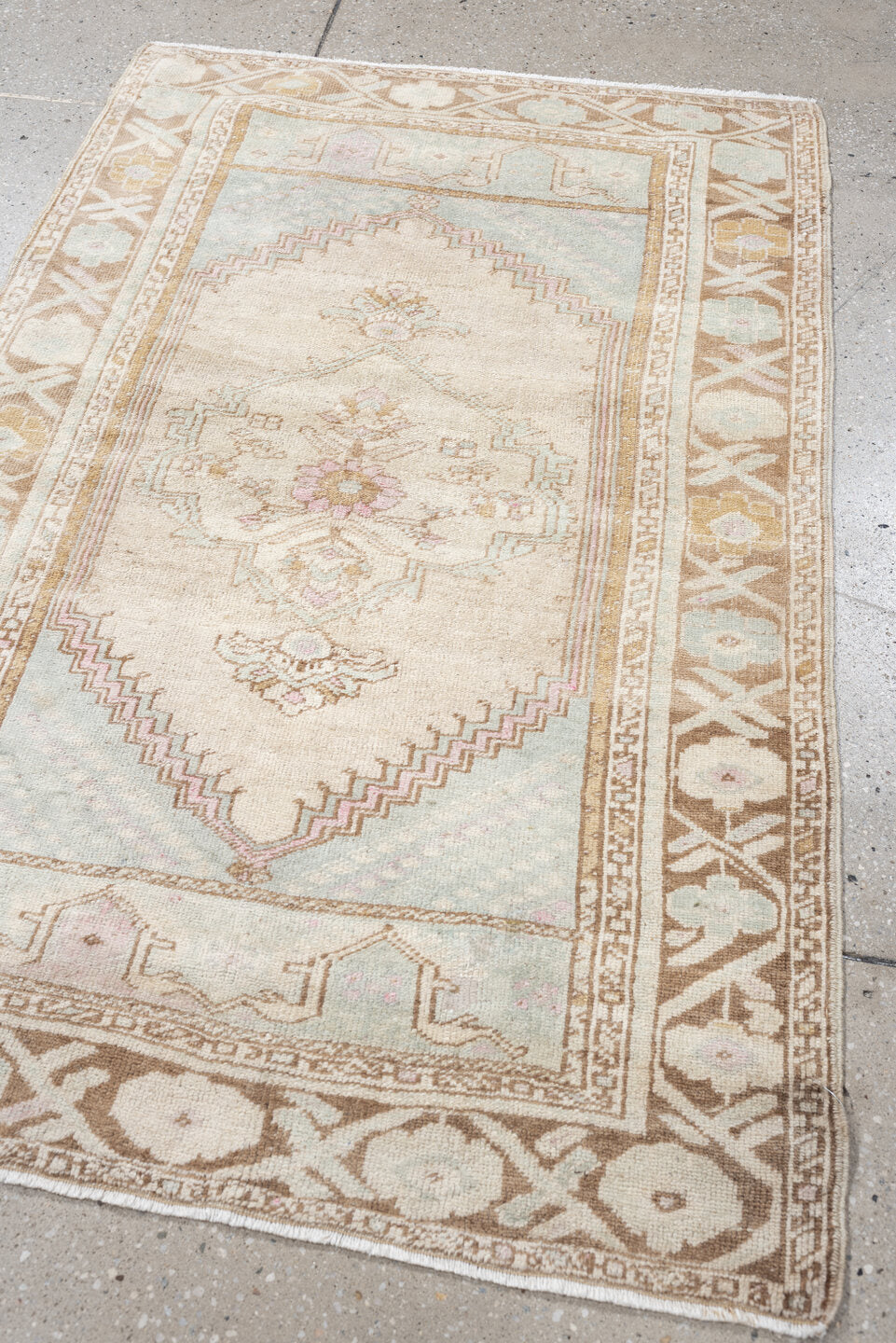 2' x 4' one-of-a-kind handmade antique Anatolian small size rug. Color palette: ivory, camel, pale blue, blush, taupe, beige