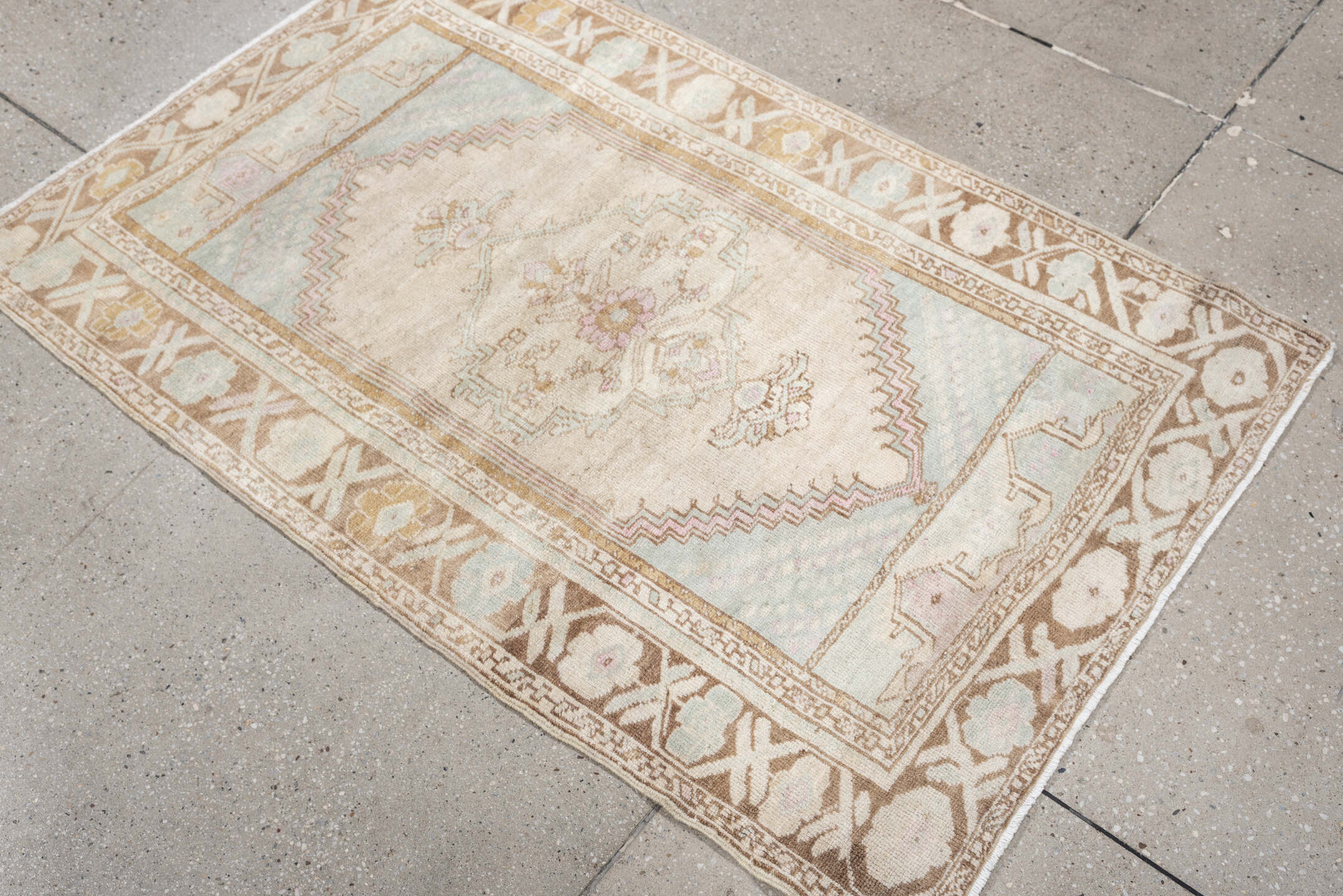 2' x 4' one-of-a-kind handmade antique Anatolian small size rug. Color palette: ivory, camel, pale blue, blush, taupe, beige