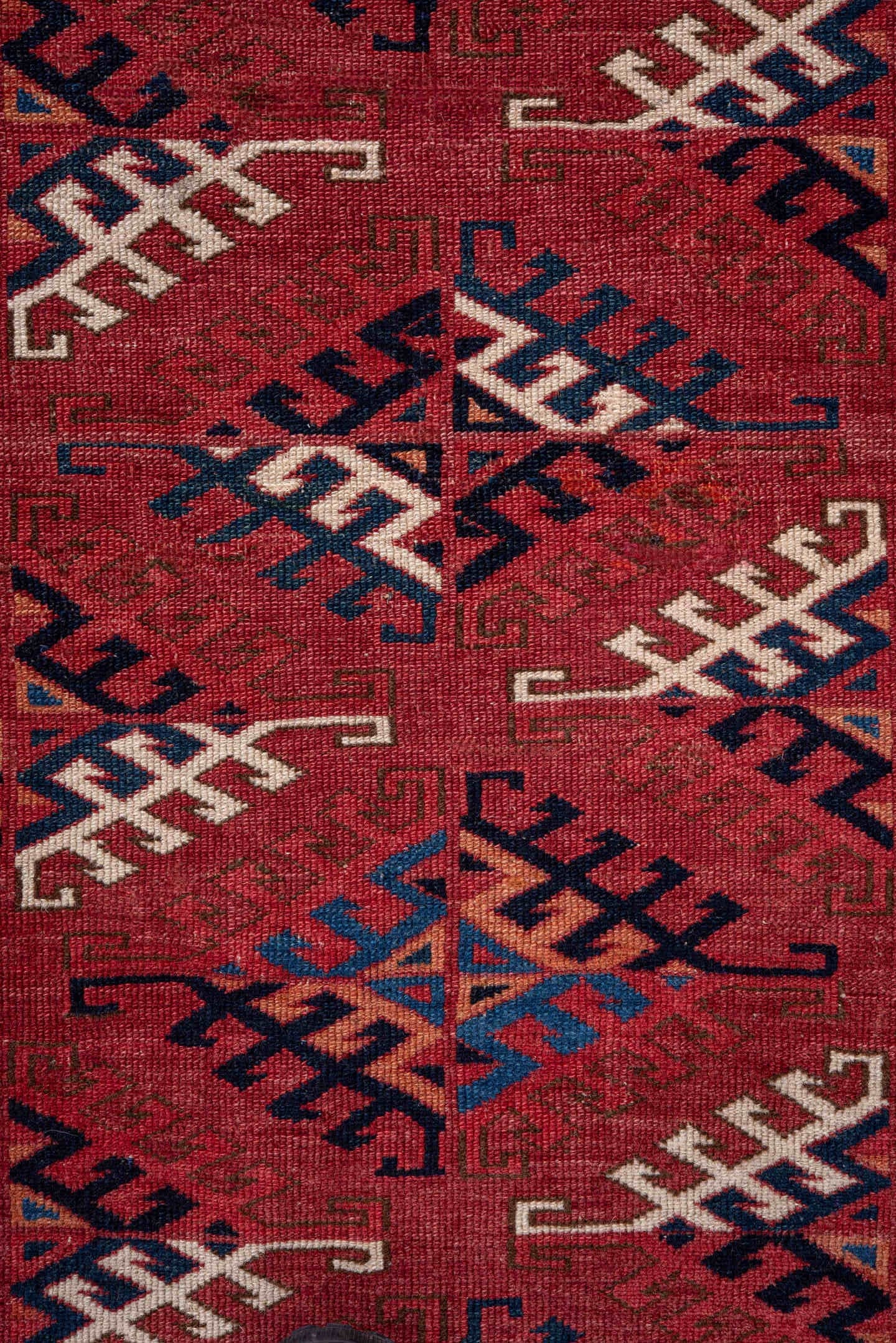 4' x 5' one-of-a-kind handmade vintage Bokara small size rug. Color palette: red, ivory, navy, burgundy, rust, cobalt, black