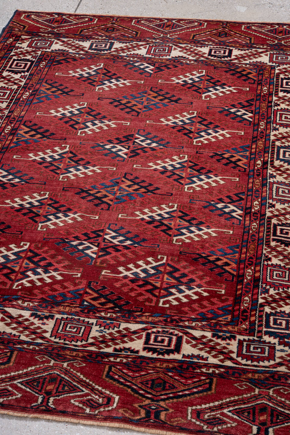 4' x 5' one-of-a-kind handmade vintage Bokara small size rug. Color palette: red, ivory, navy, burgundy, rust, cobalt, black