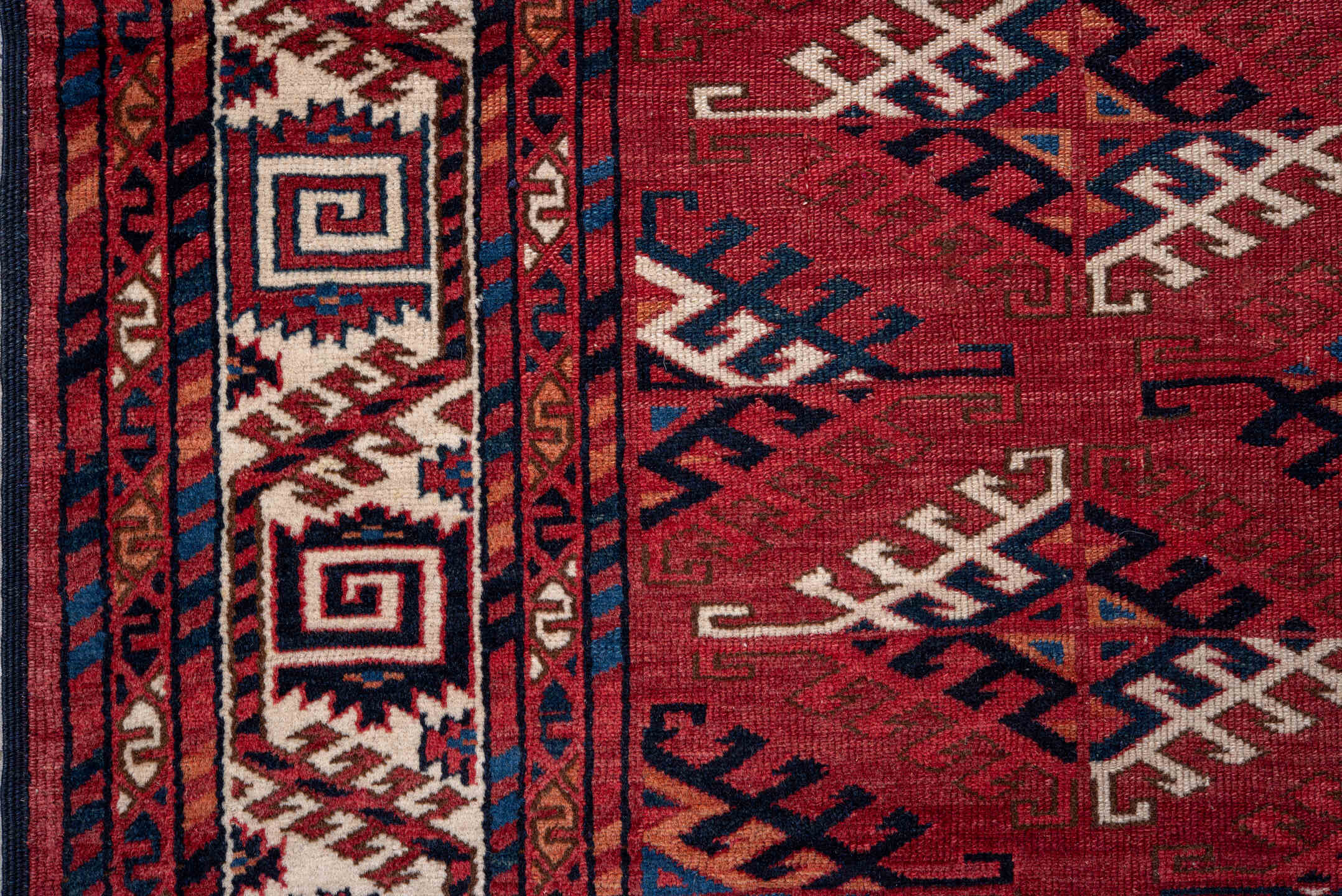 4' x 5' one-of-a-kind handmade vintage Bokara small size rug. Color palette: red, ivory, navy, burgundy, rust, cobalt, black