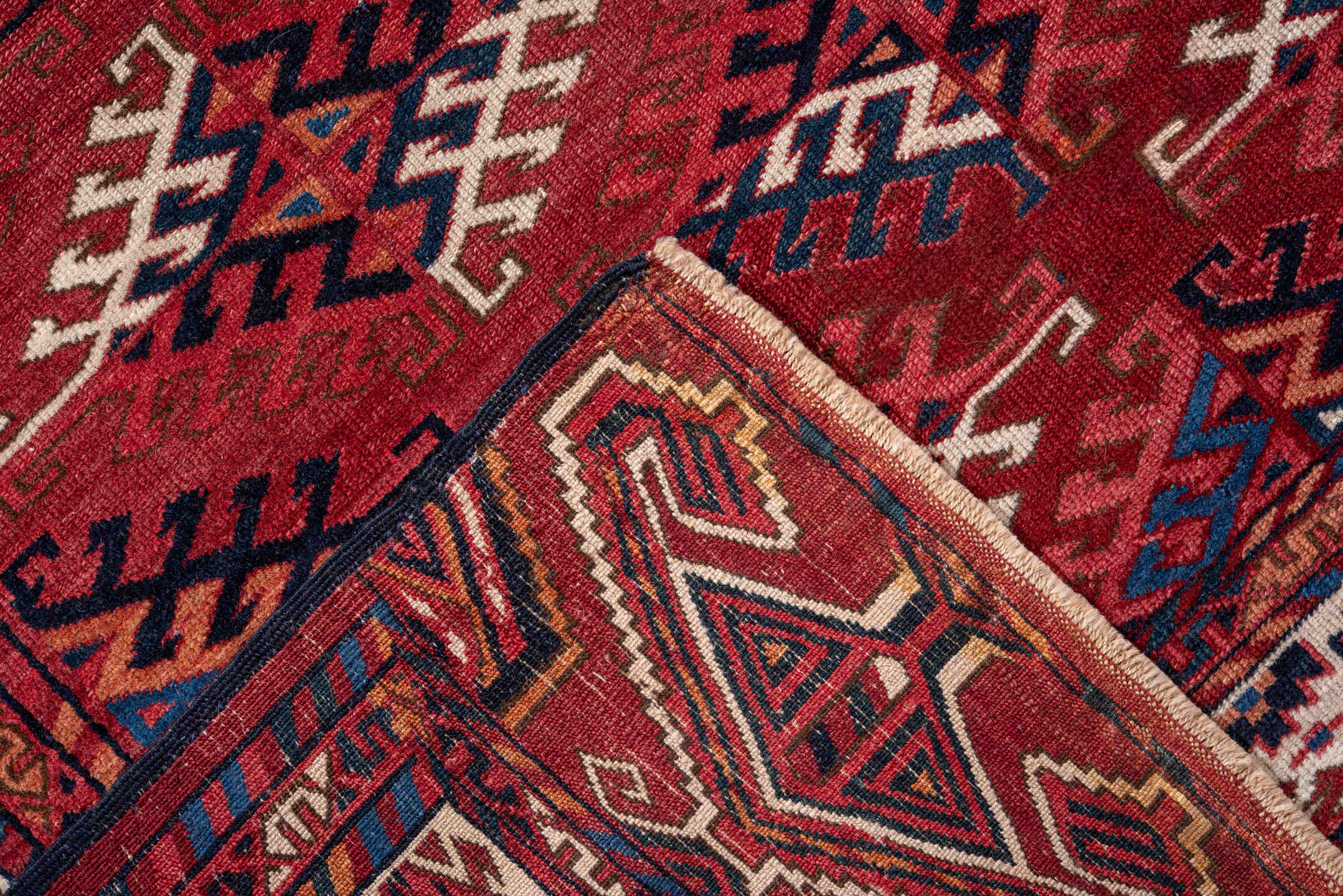 4' x 5' one-of-a-kind handmade vintage Bokara small size rug. Color palette: red, ivory, navy, burgundy, rust, cobalt, black