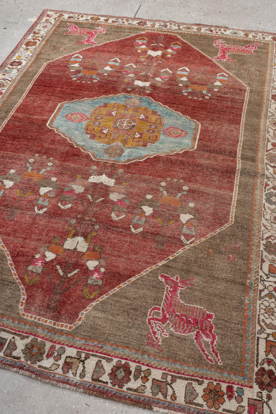 5' x 7' one-of-a-kind handmade antique Gabbe rug. Color palette: rust, taupe, ivory, sky blue, terra cotta, sage, gold, rose