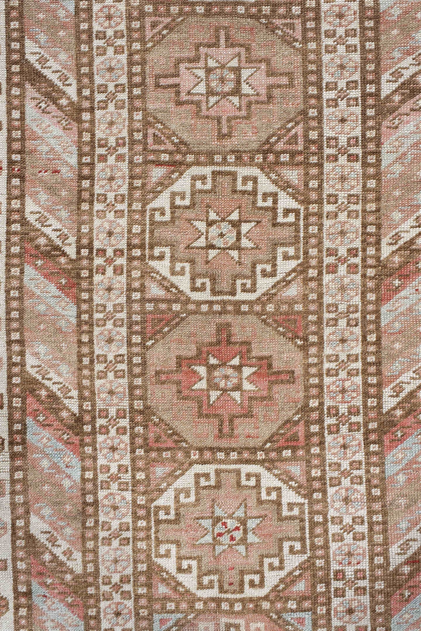 4' x 10' one-of-a-kind handmade antique Caucasian runner rug. Color palette: ivory, taupe, rose, rust, camel, brown, beige